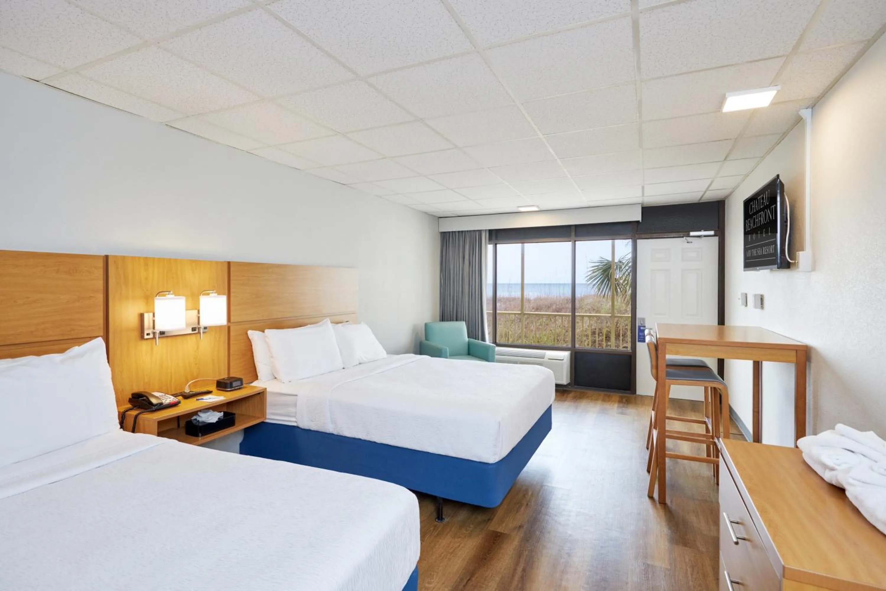 Bed in Chateau Beachfront Hotel, a By the Sea Resort