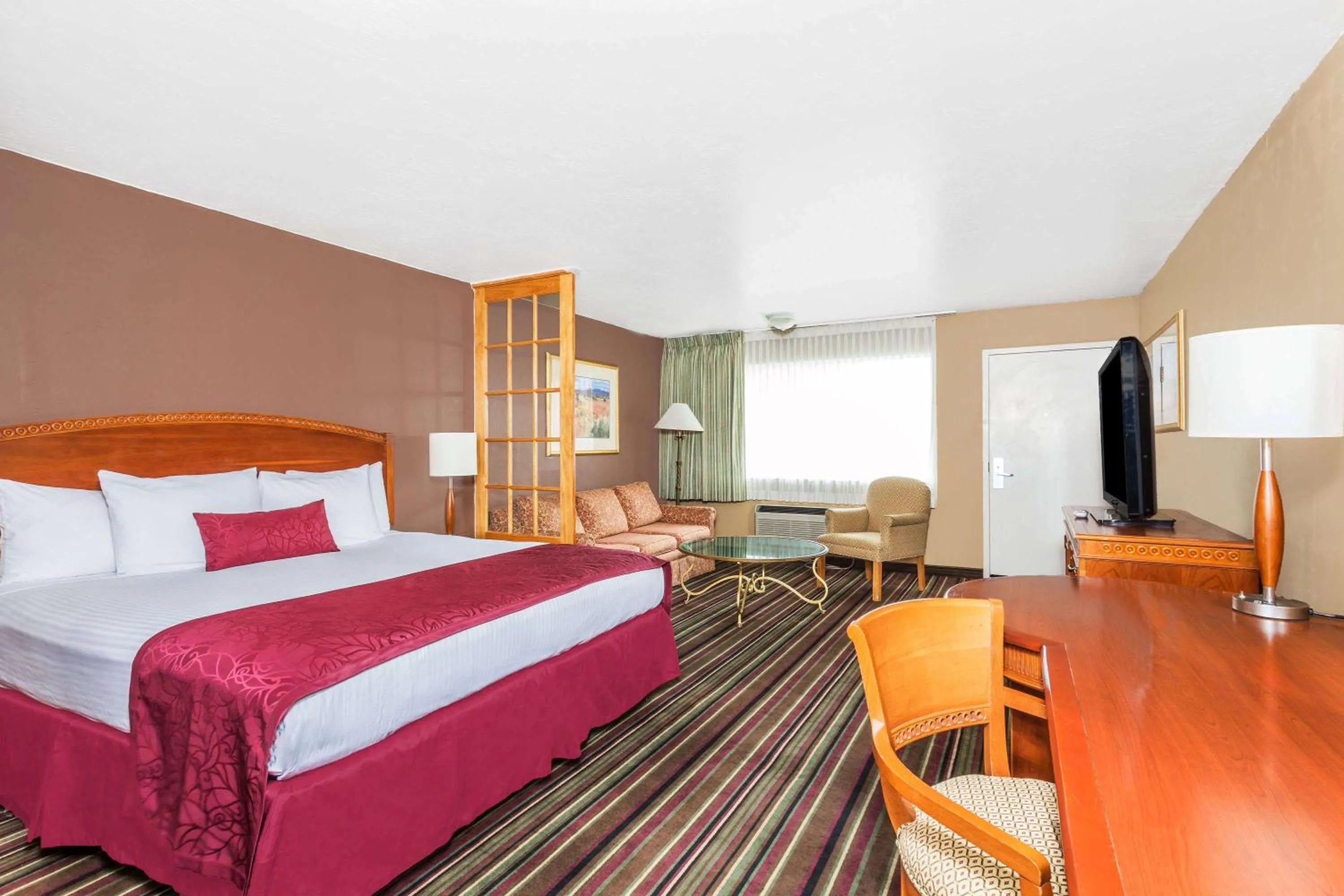 Photo of the whole room, Bed in Days Inn & Suites by Wyndham Logan