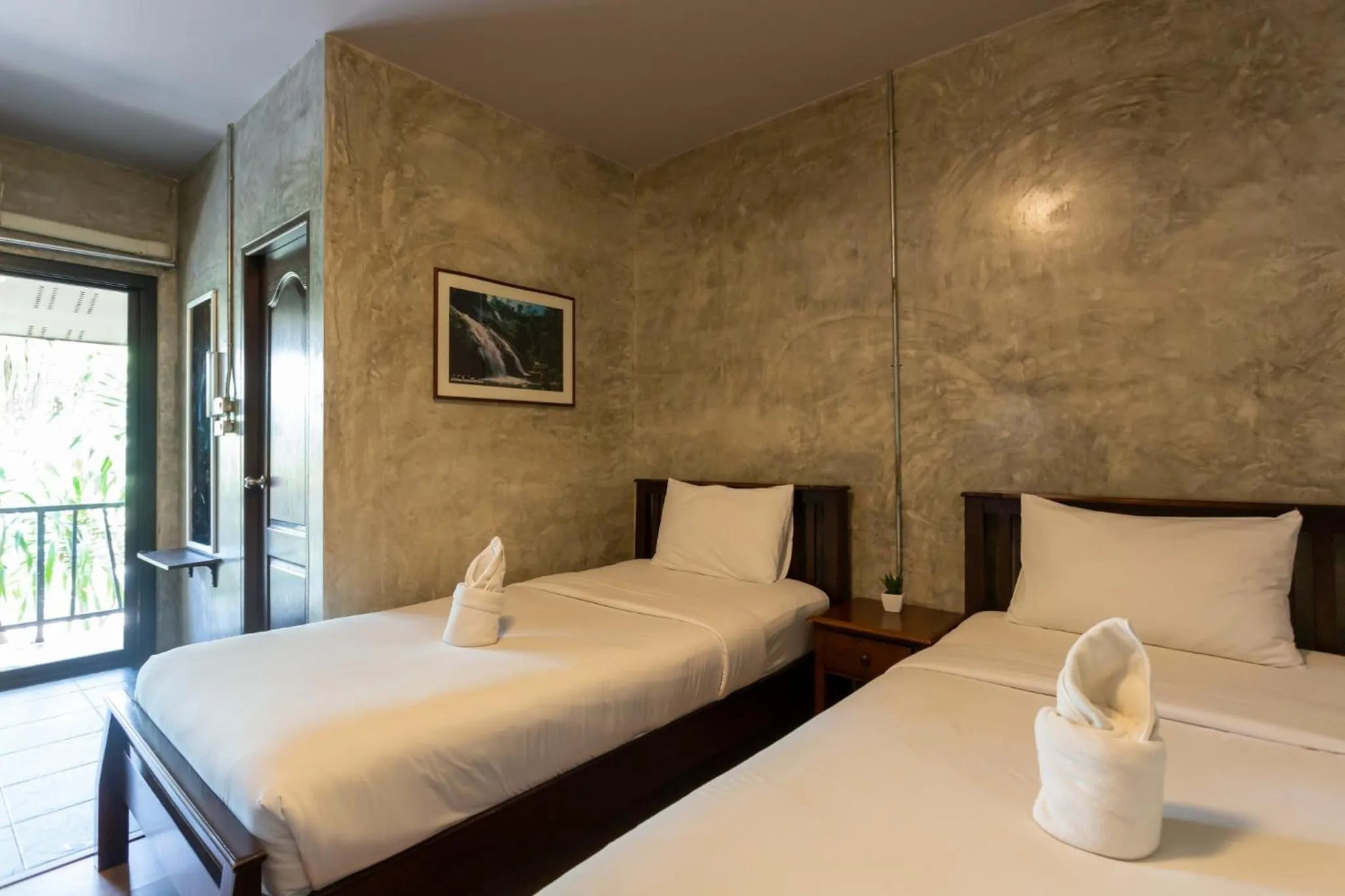 Bed in Baan Suan Ramita Resort