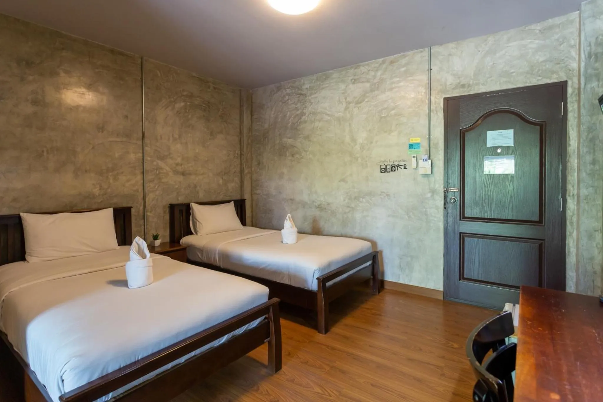 Bed in Baan Suan Ramita Resort