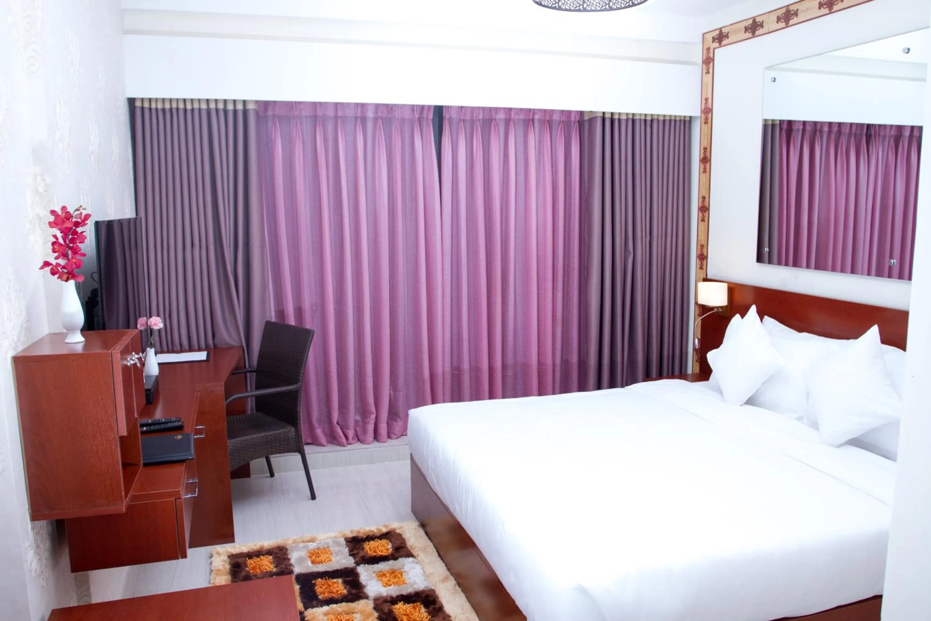 Bed in Coventina Lake Suites