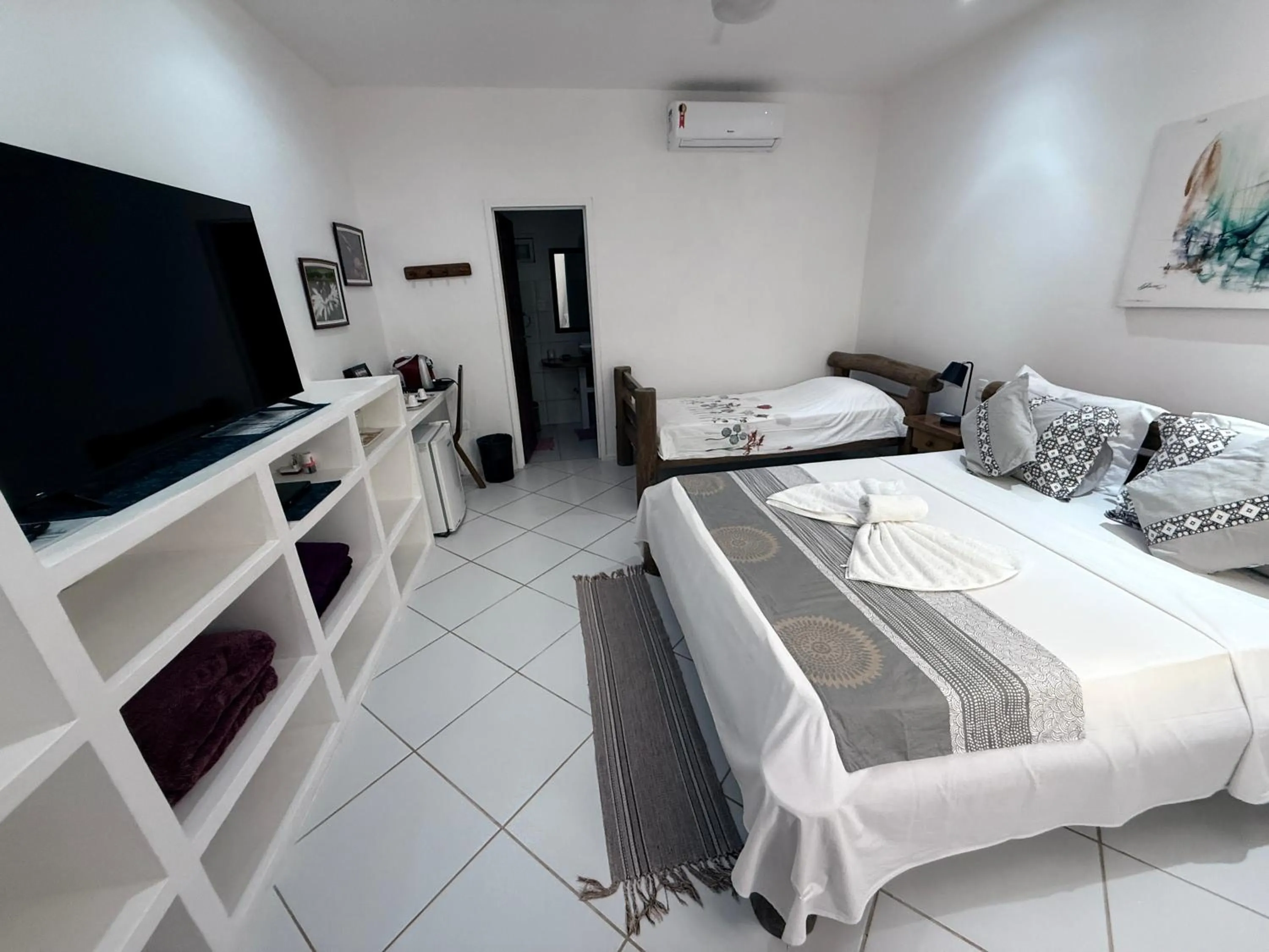 Bed in Pousada Caminho da Praia