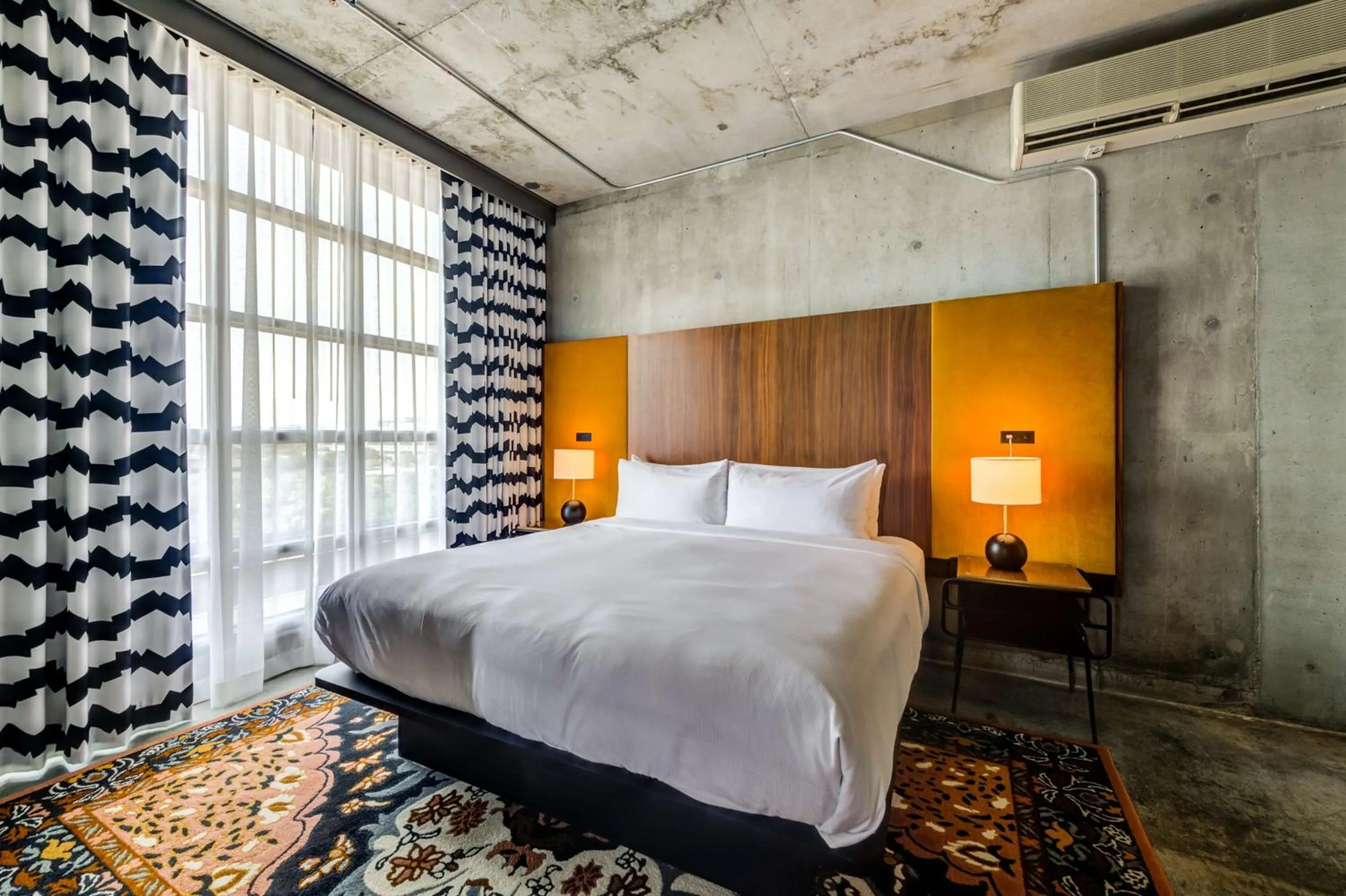 Bed in NYLO Las Colinas Hotel, Tapestry Collection by Hilton