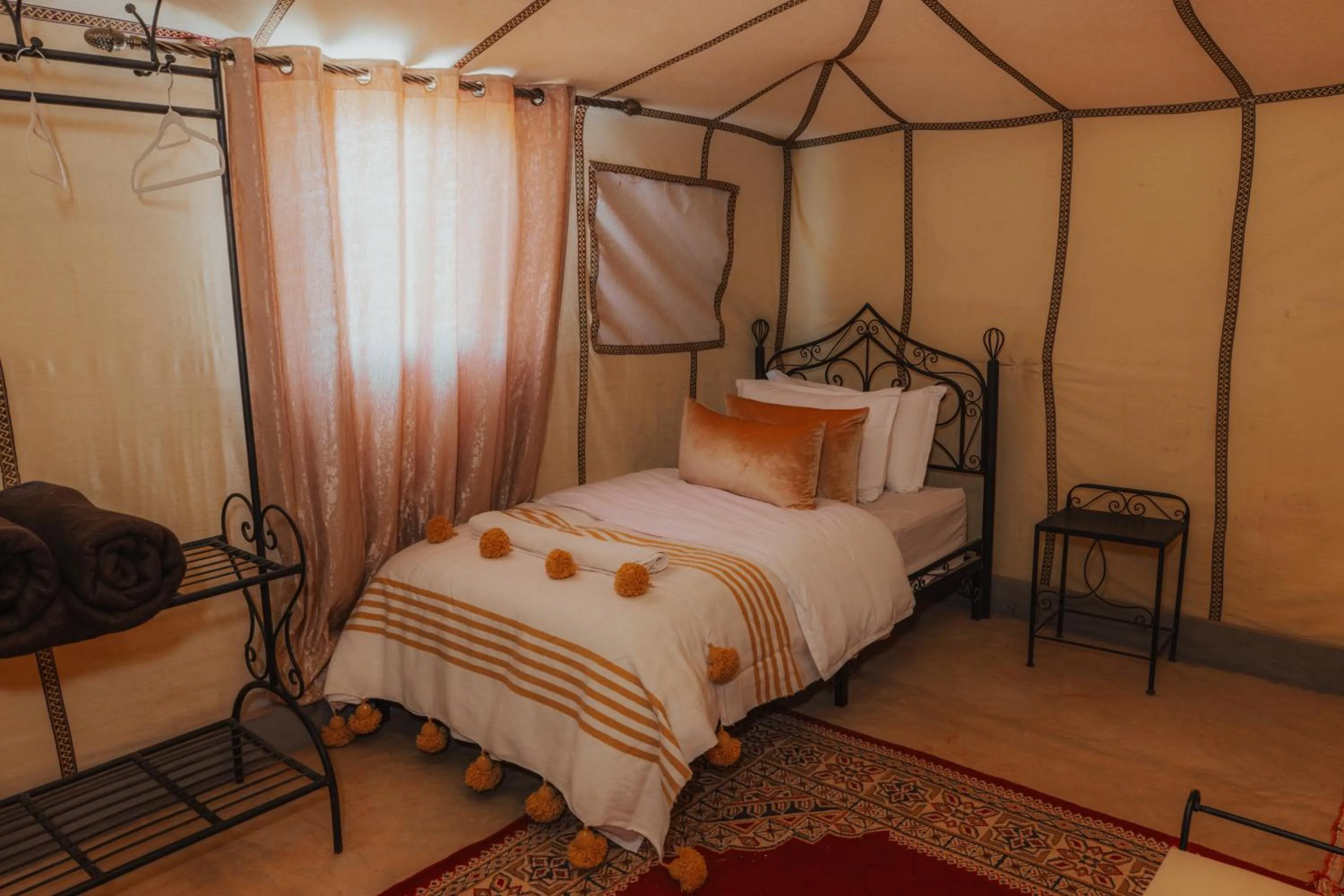 Bed in Tassili Luxury Desert Camp