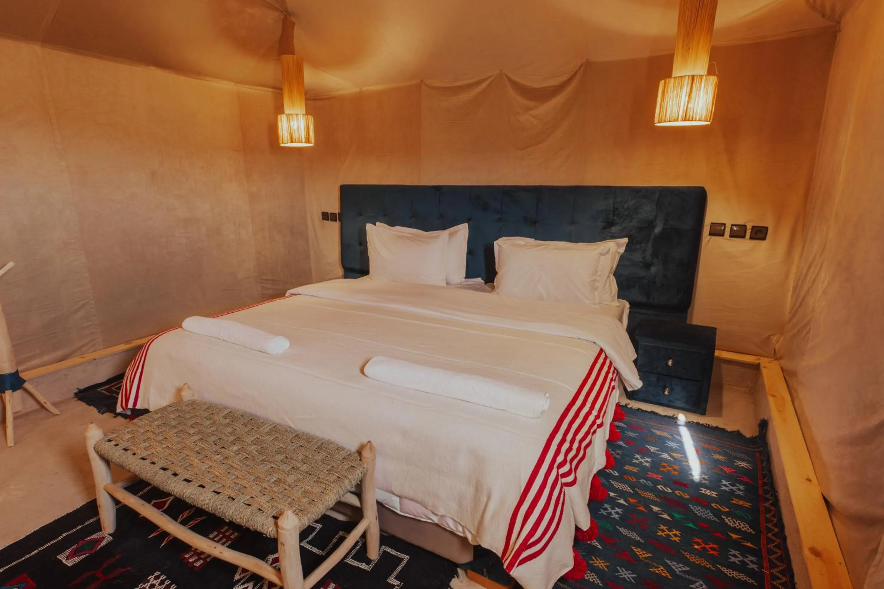Bed in Tassili Luxury Desert Camp