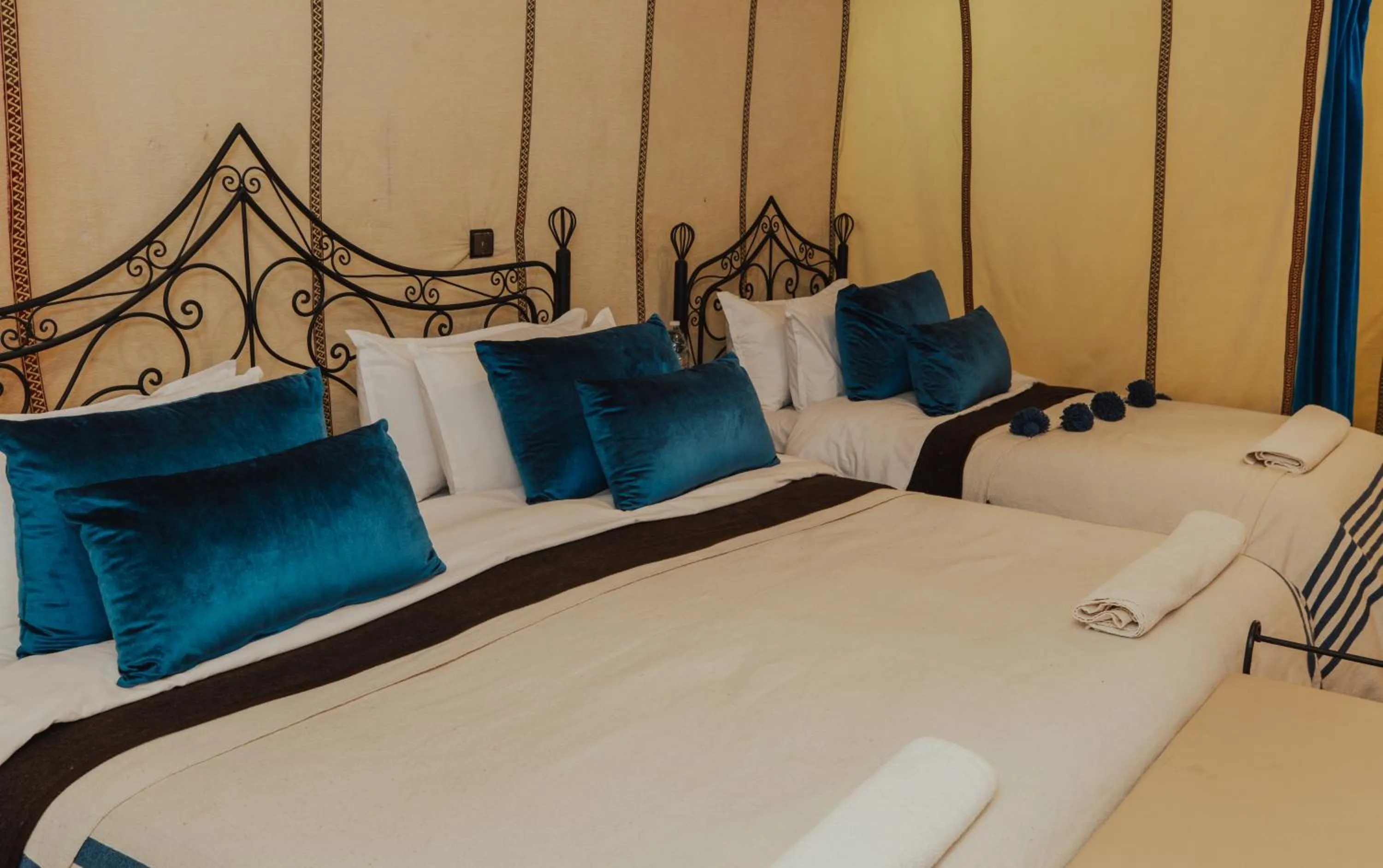 Bed in Tassili Luxury Desert Camp