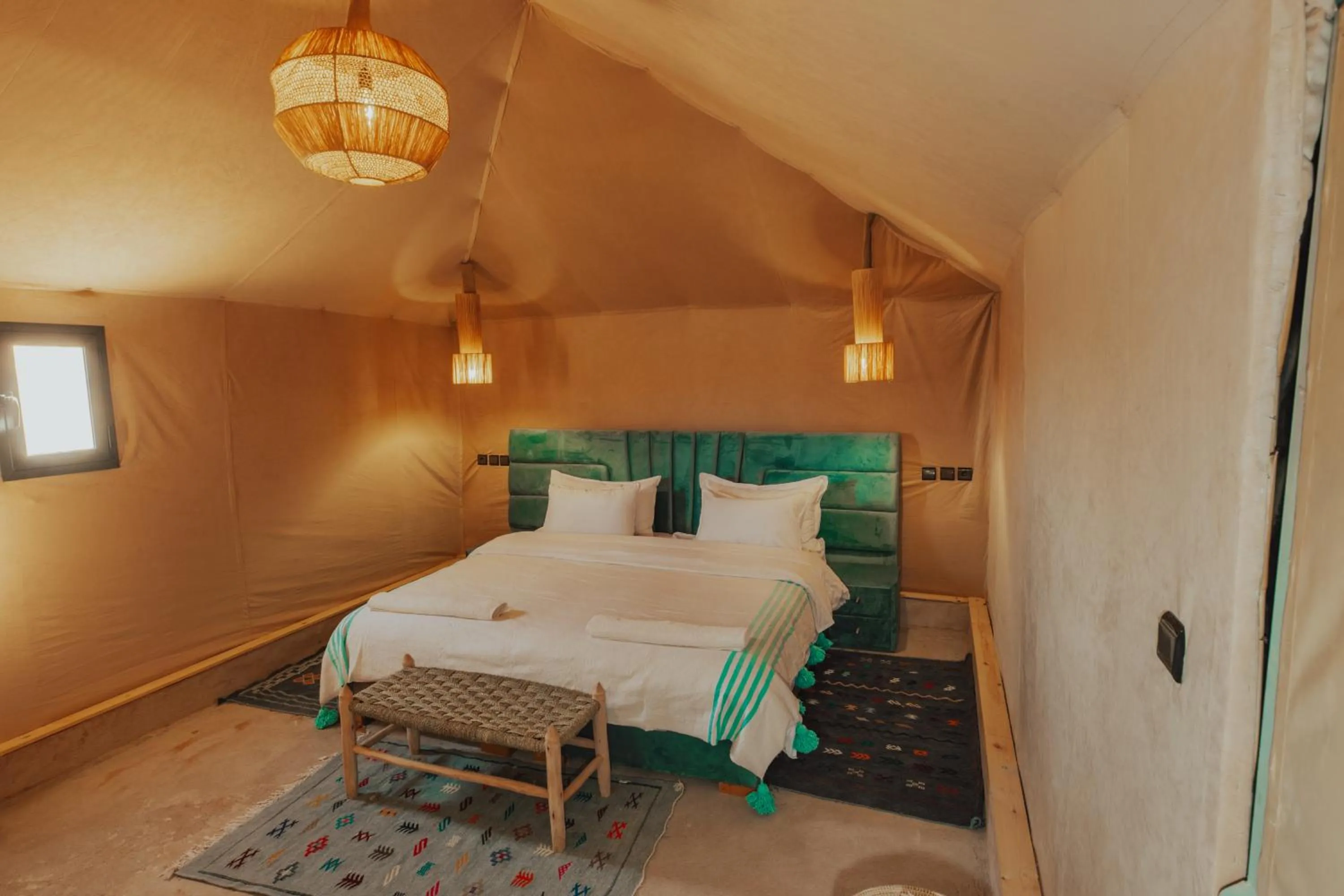 Bed in Tassili Luxury Desert Camp