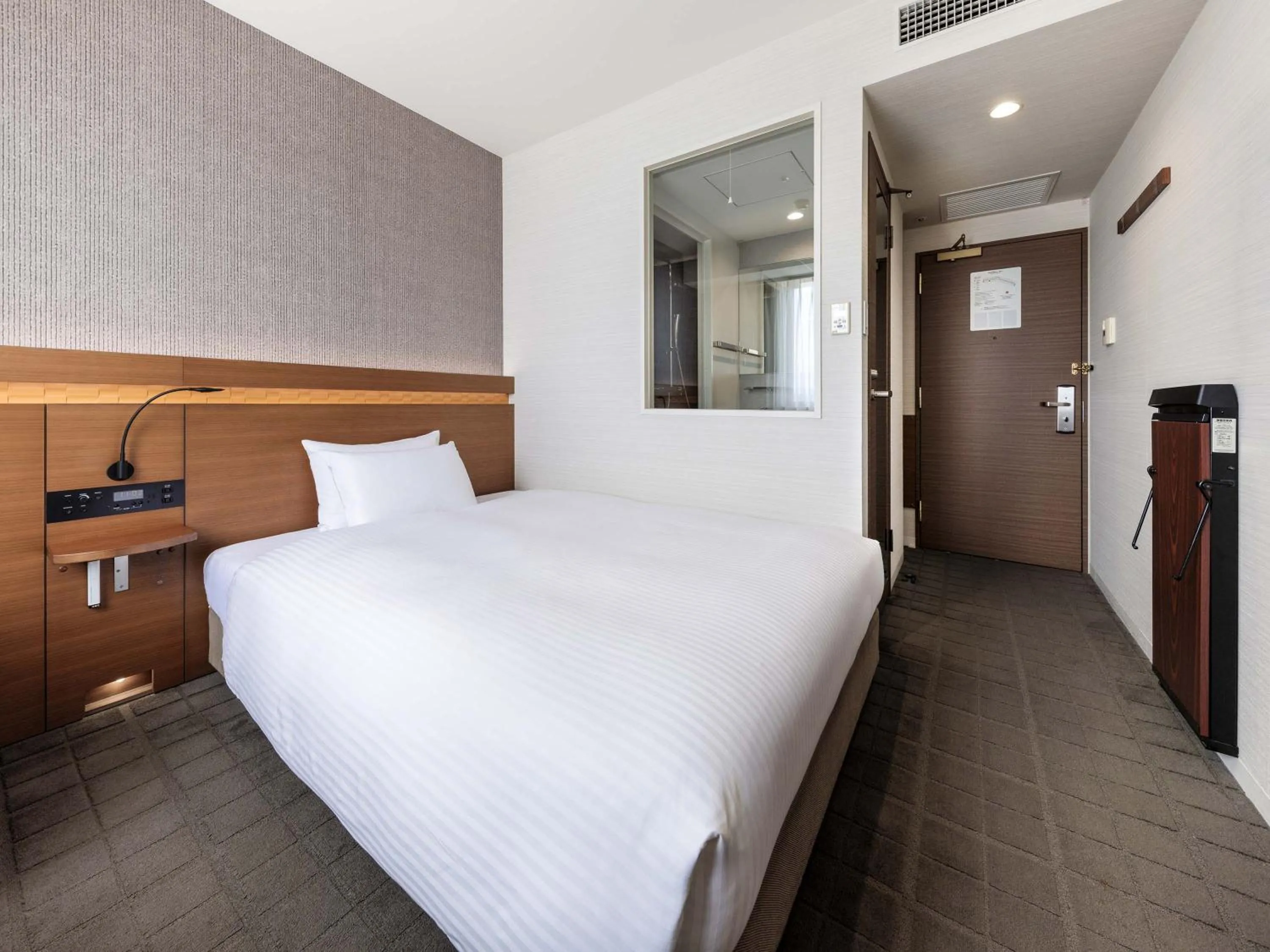 Photo of the whole room, Bed in Nishitetsu Hotel Croom Hakata