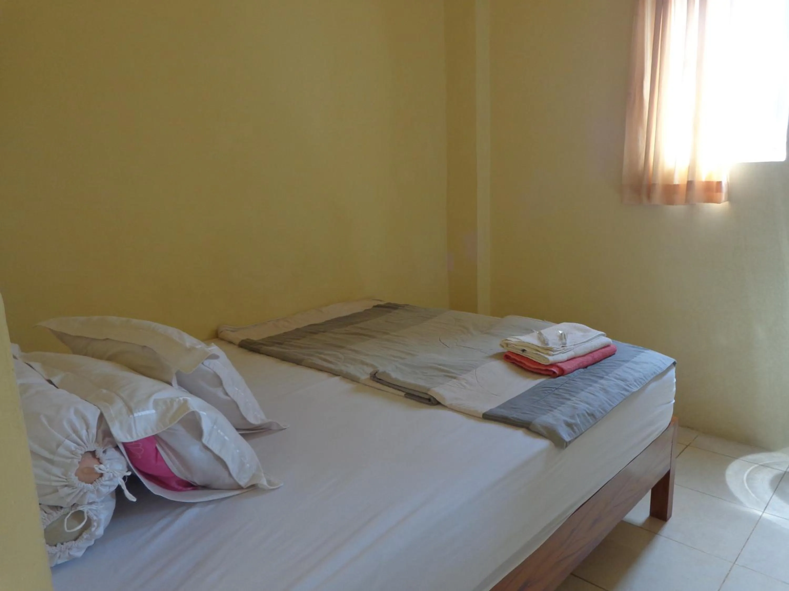 Bed in Hotel Musafir Inn