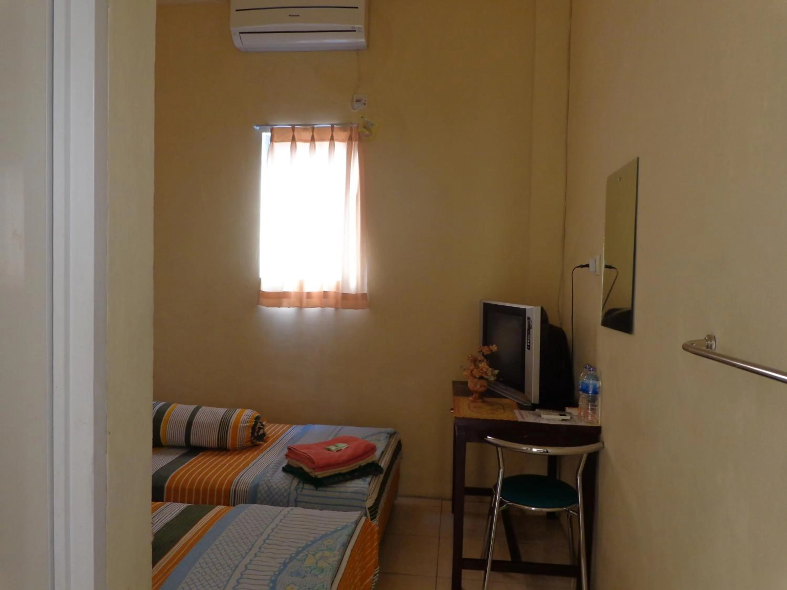 Bed in Hotel Musafir Inn