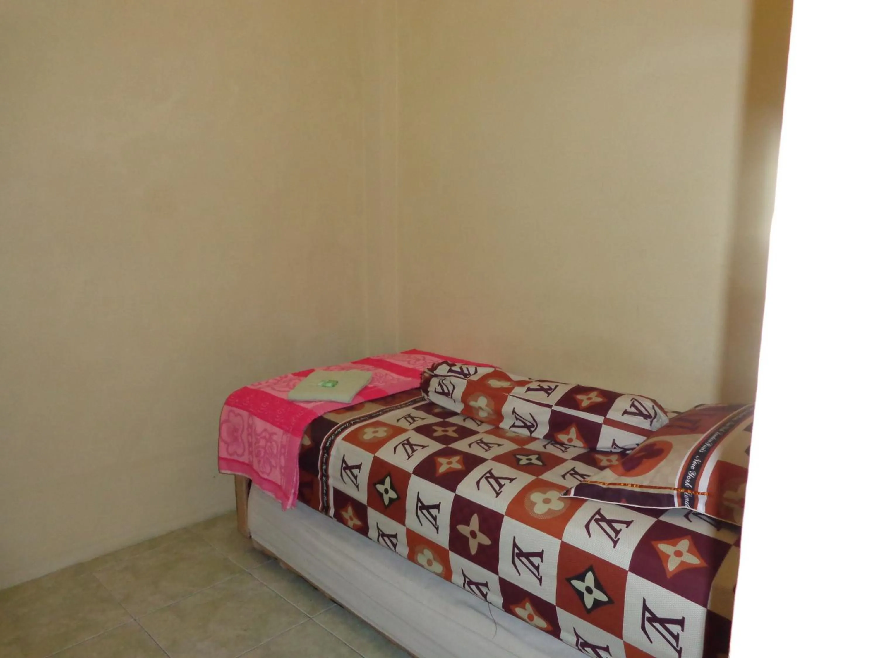 Bed in Hotel Musafir Inn