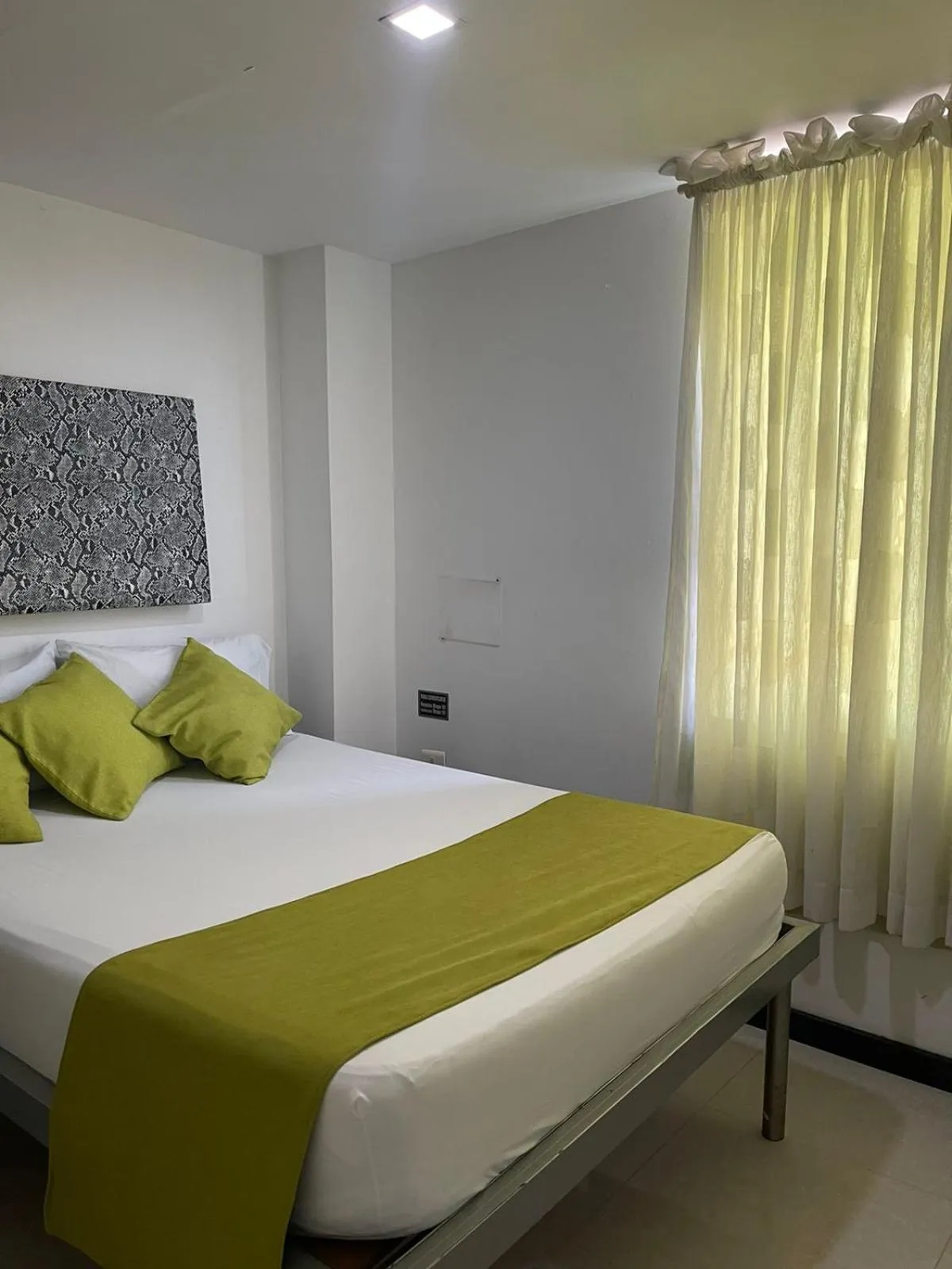 Photo of the whole room, Bed in Hotel Plaza Norte Cali