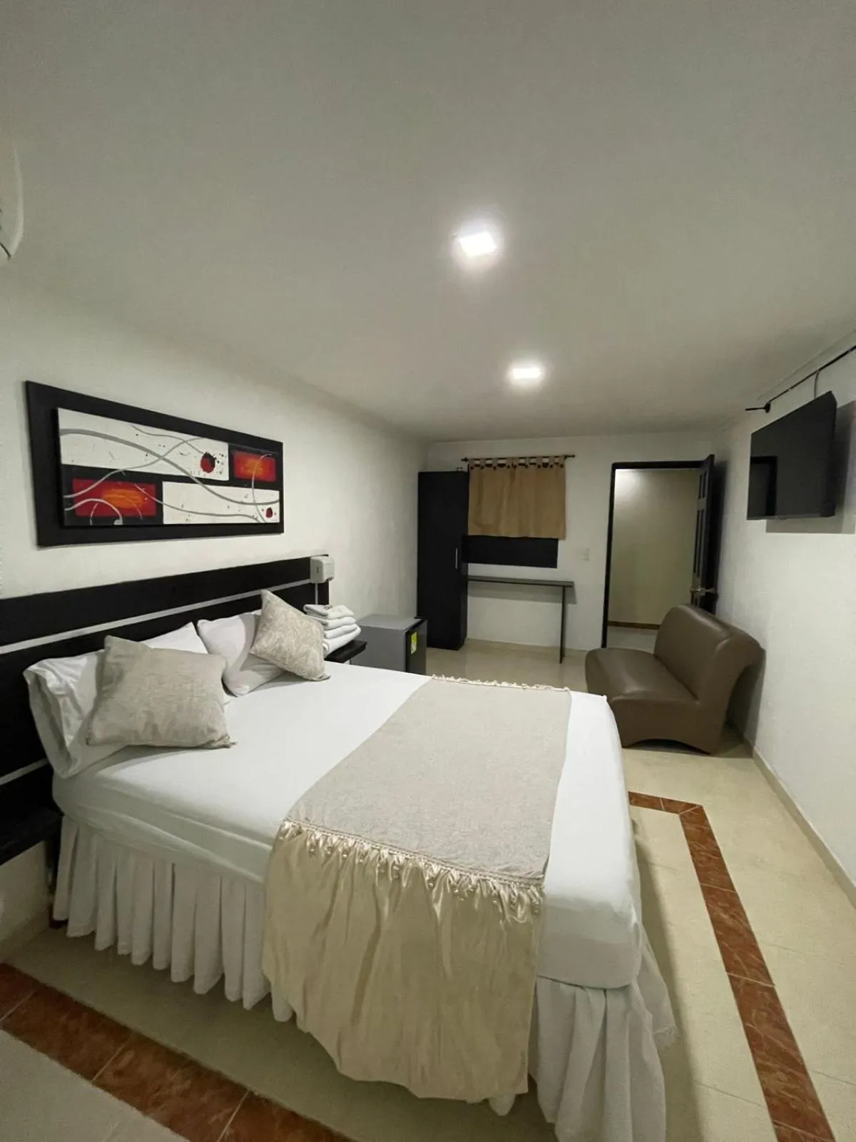 Communal lounge/ TV room, Bed in Hotel Plaza Norte Cali