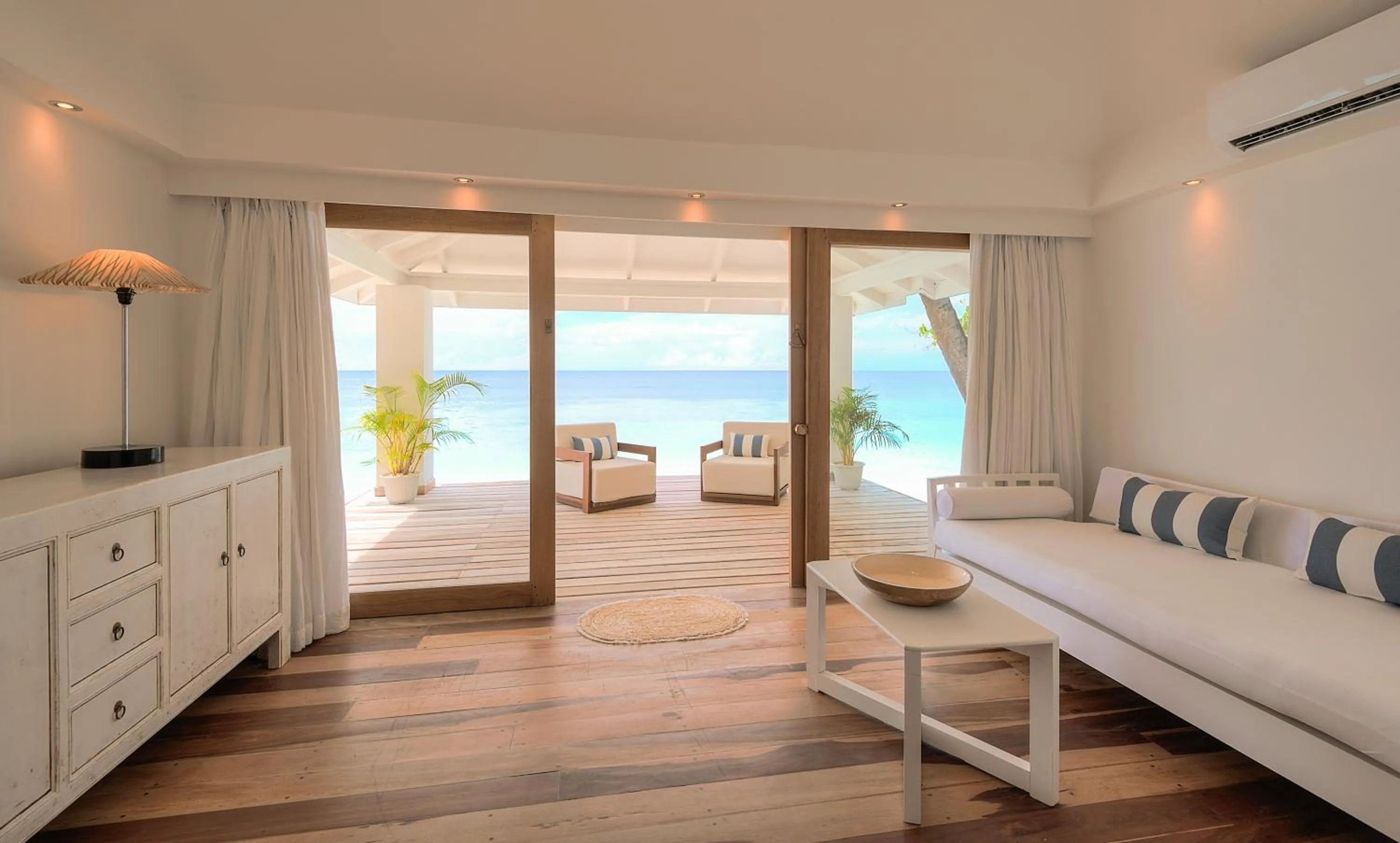 Seating area, Bed in Diamonds Athuruga Maldives Resort & Spa