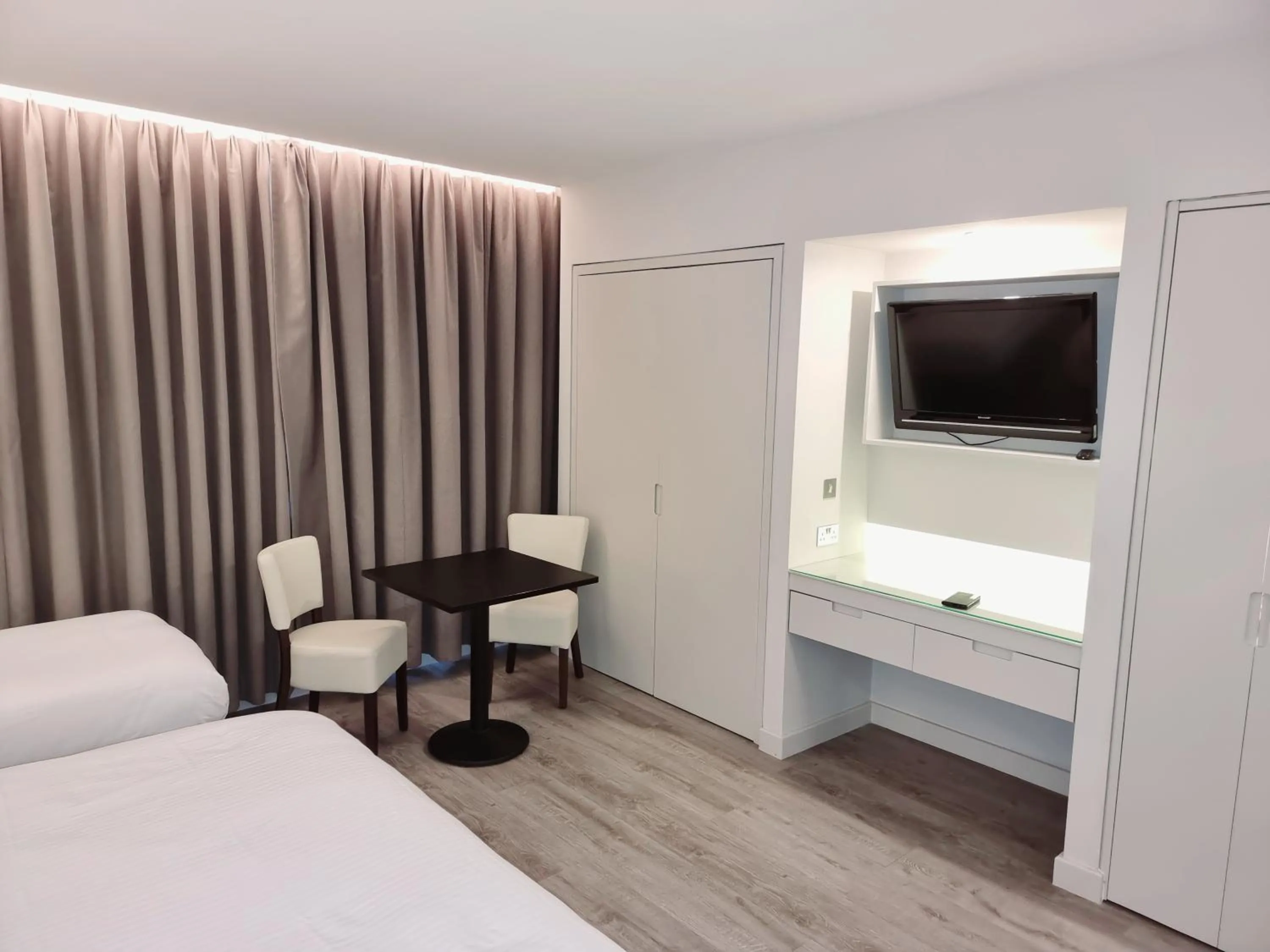 Bed in Axiom Park Hotel