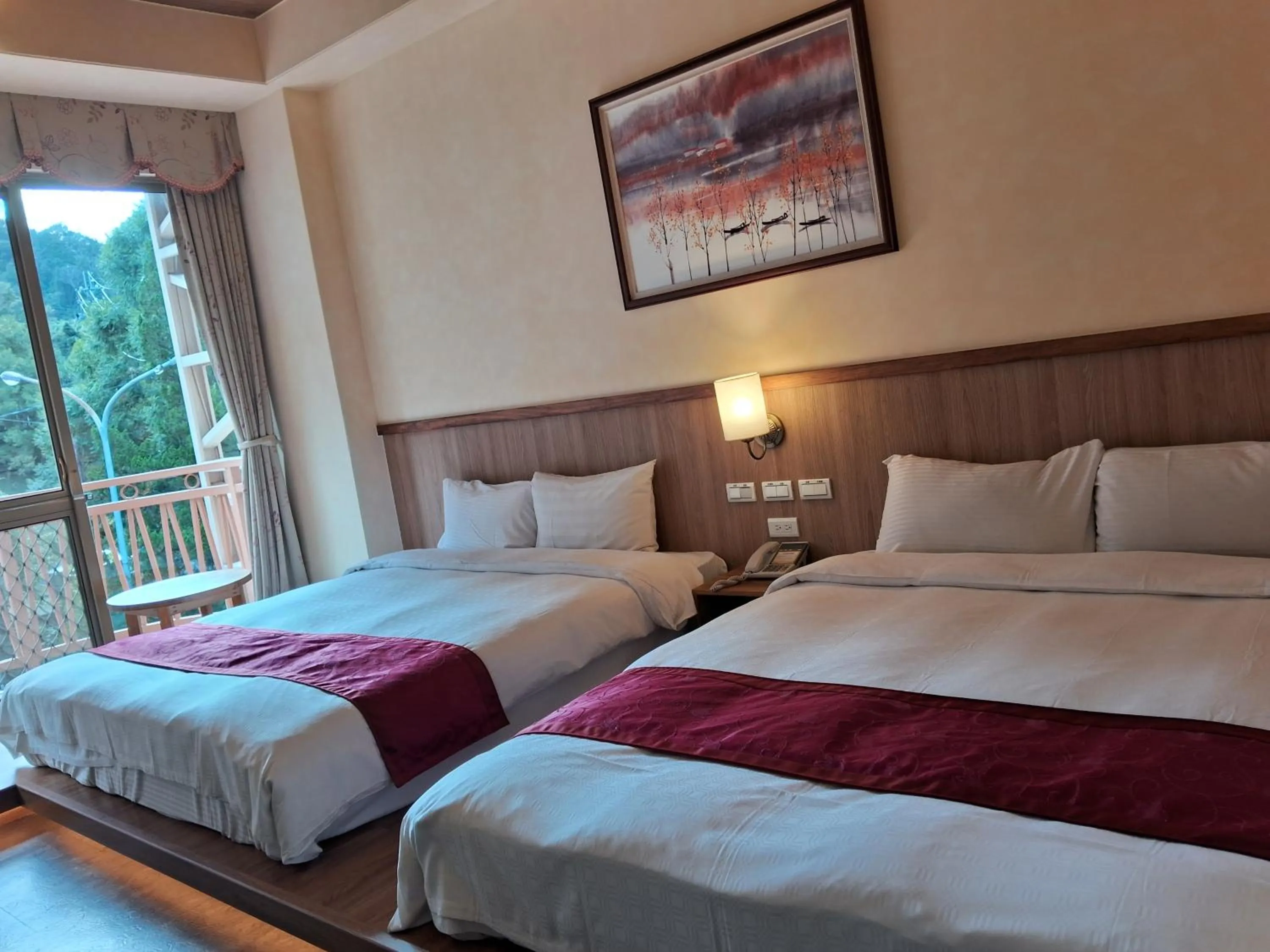 Bed in Ku Kuan Resort Hotel