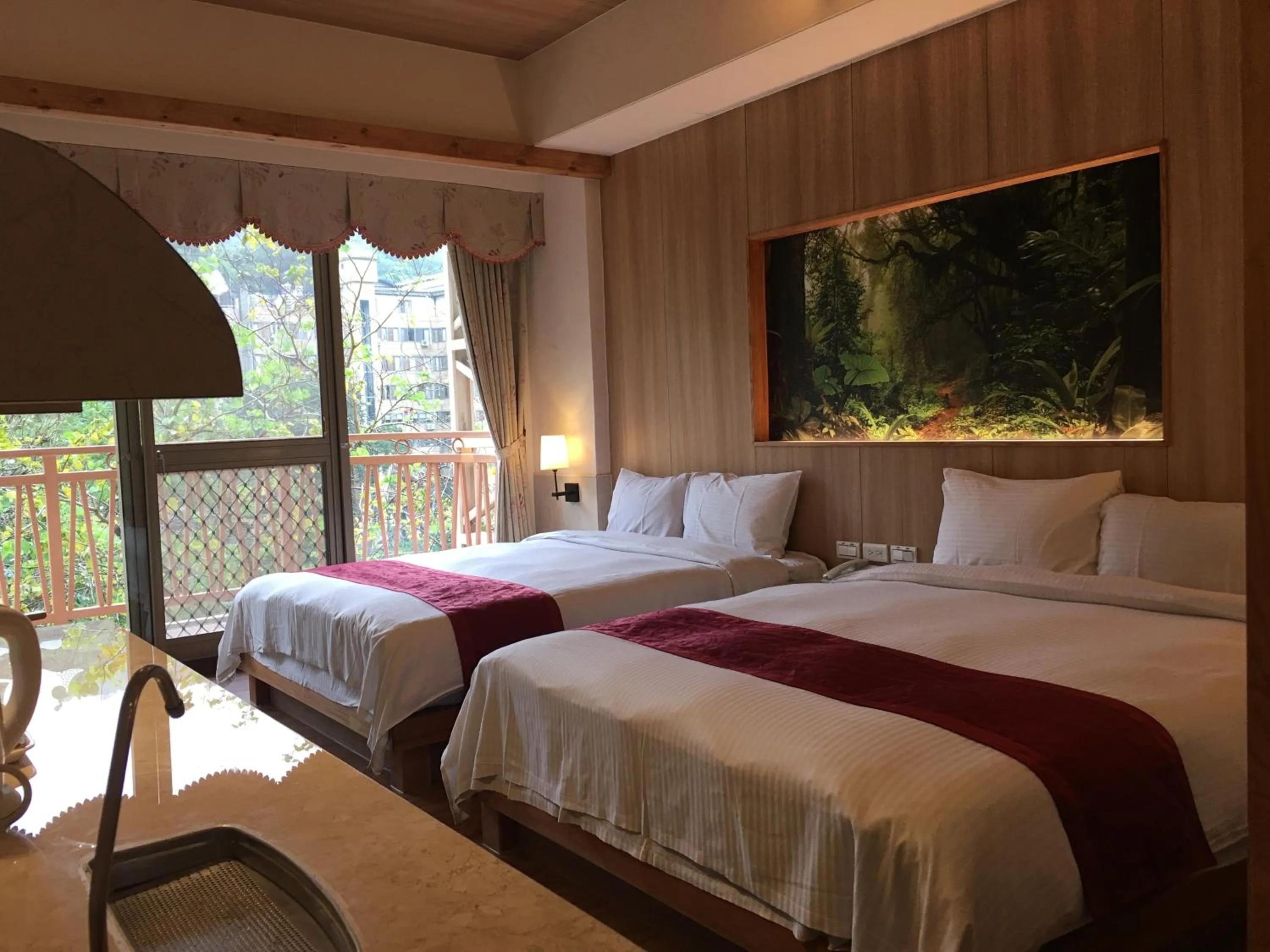 Bed in Ku Kuan Resort Hotel