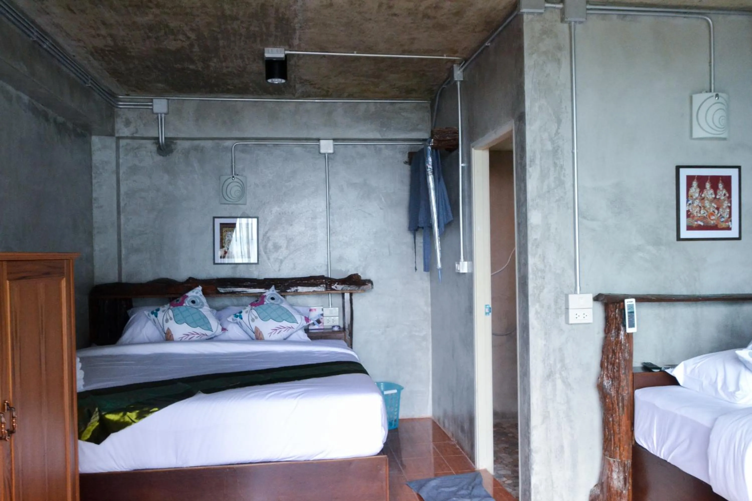 Bed in Baan Tubkaek Hotel