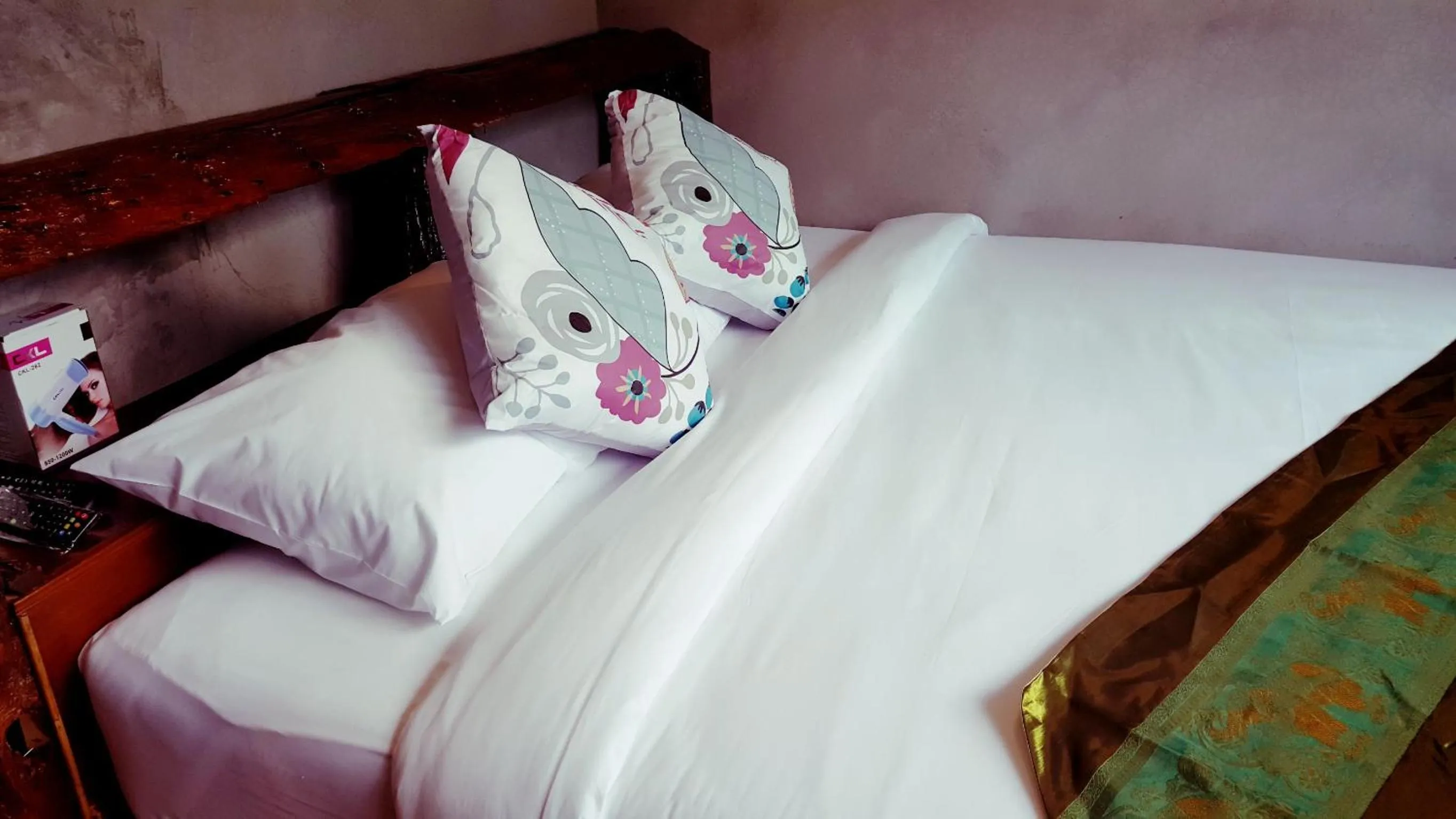 Bed in Baan Tubkaek Hotel