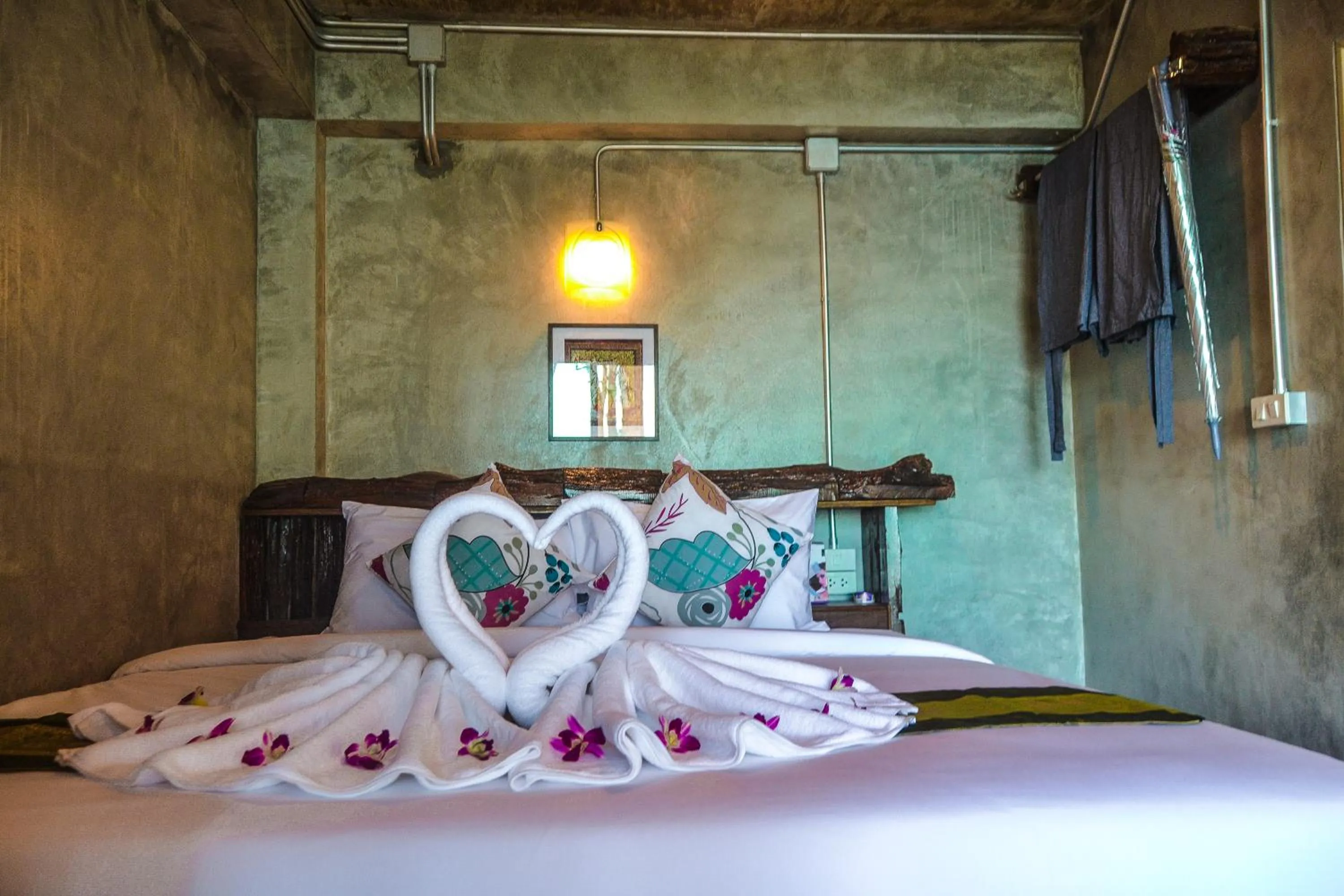 Bed in Baan Tubkaek Hotel