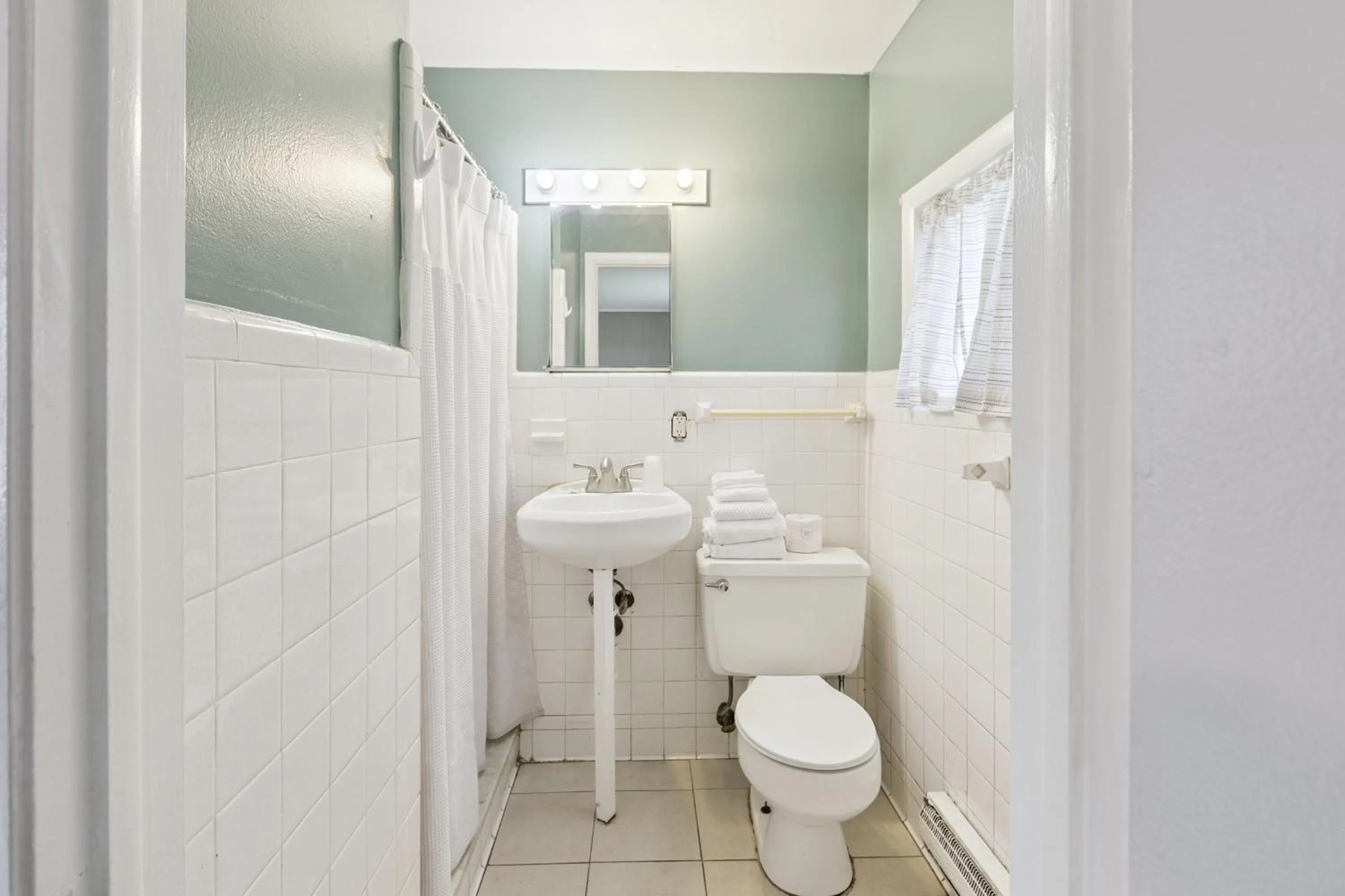 Bathroom in Currys Motel by OYO Saginaw MI