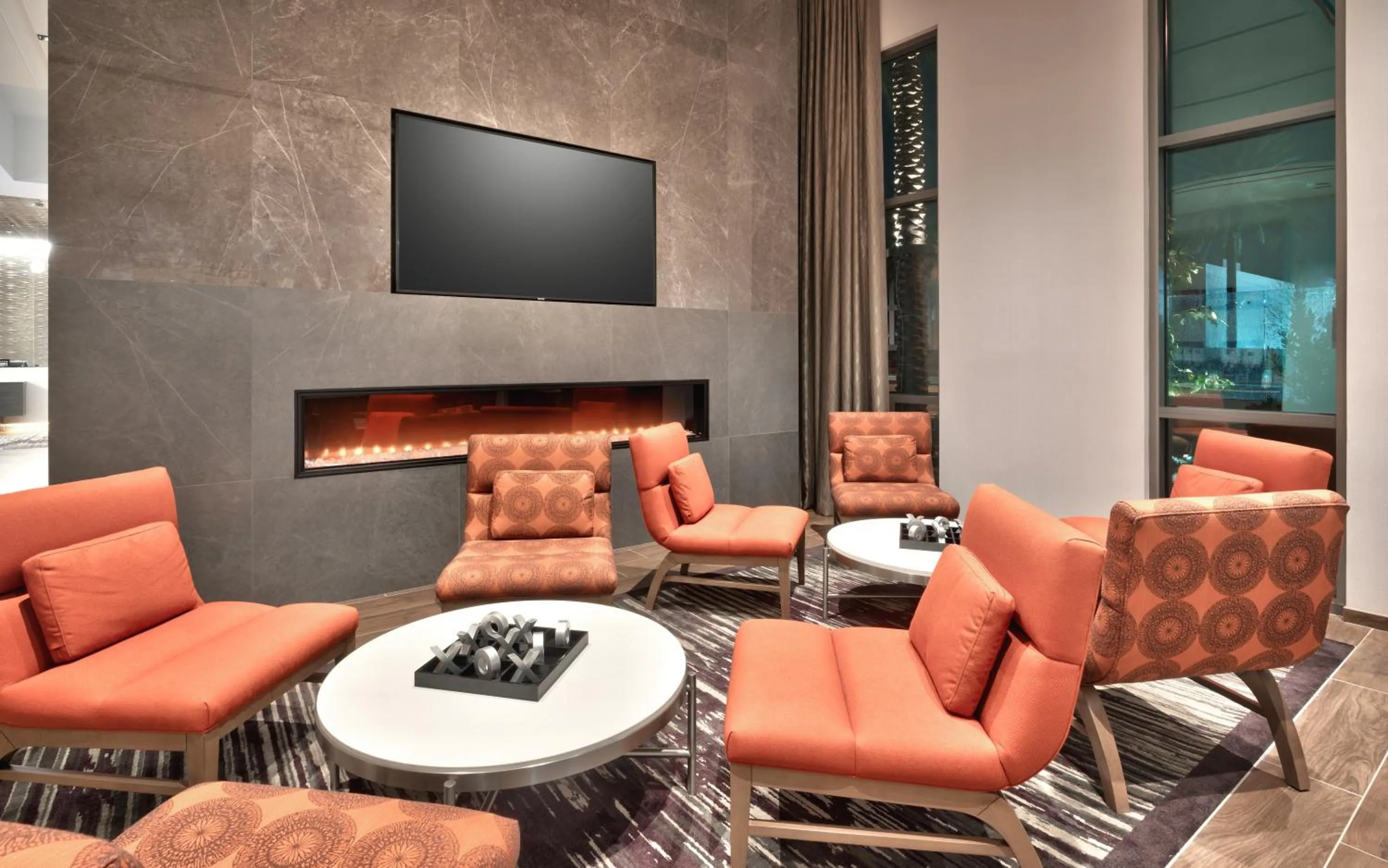 Communal lounge/ TV room in Hampton Inn & Suites Anaheim Resort Convention Center