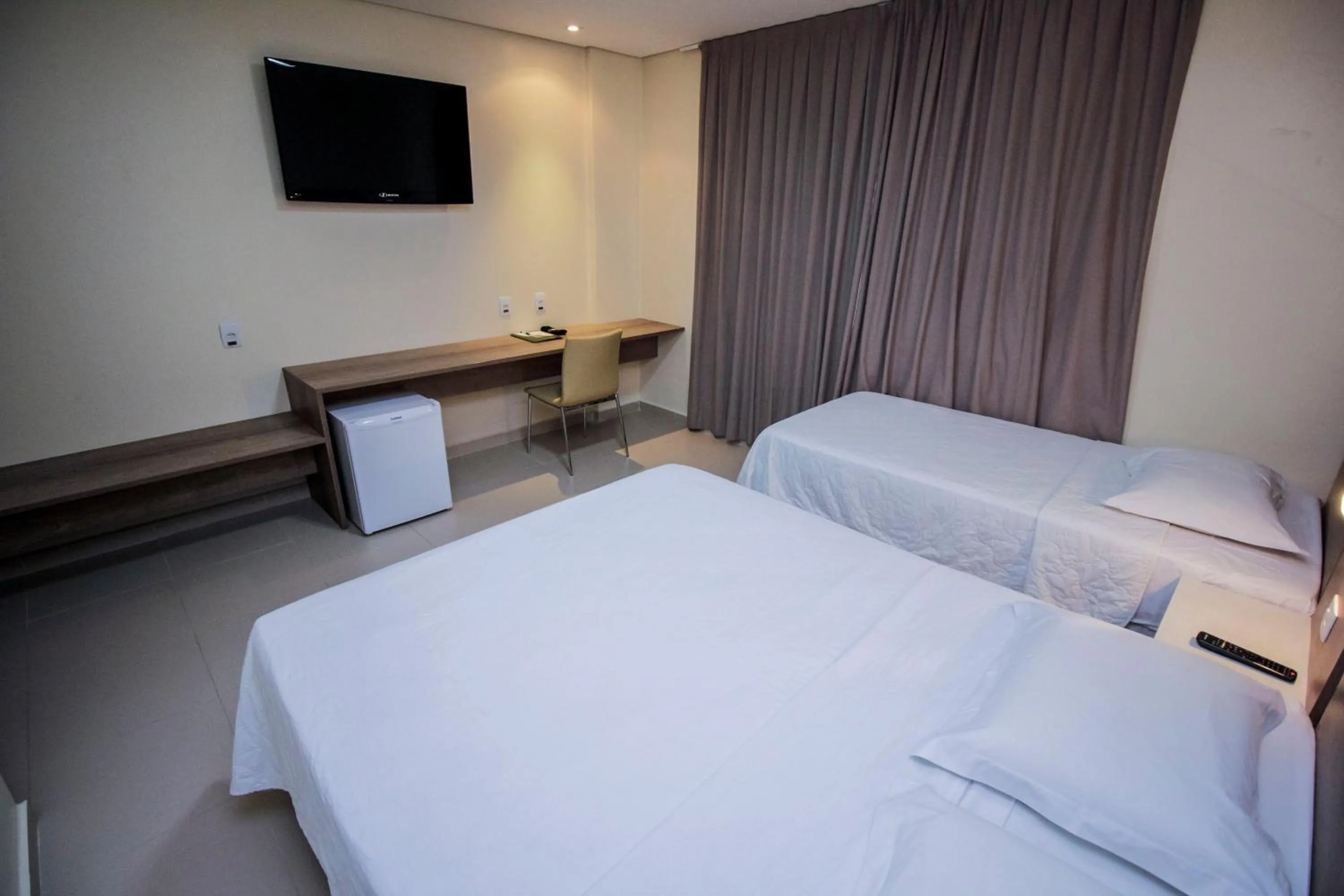 Bed in Golden Plaza Hotel