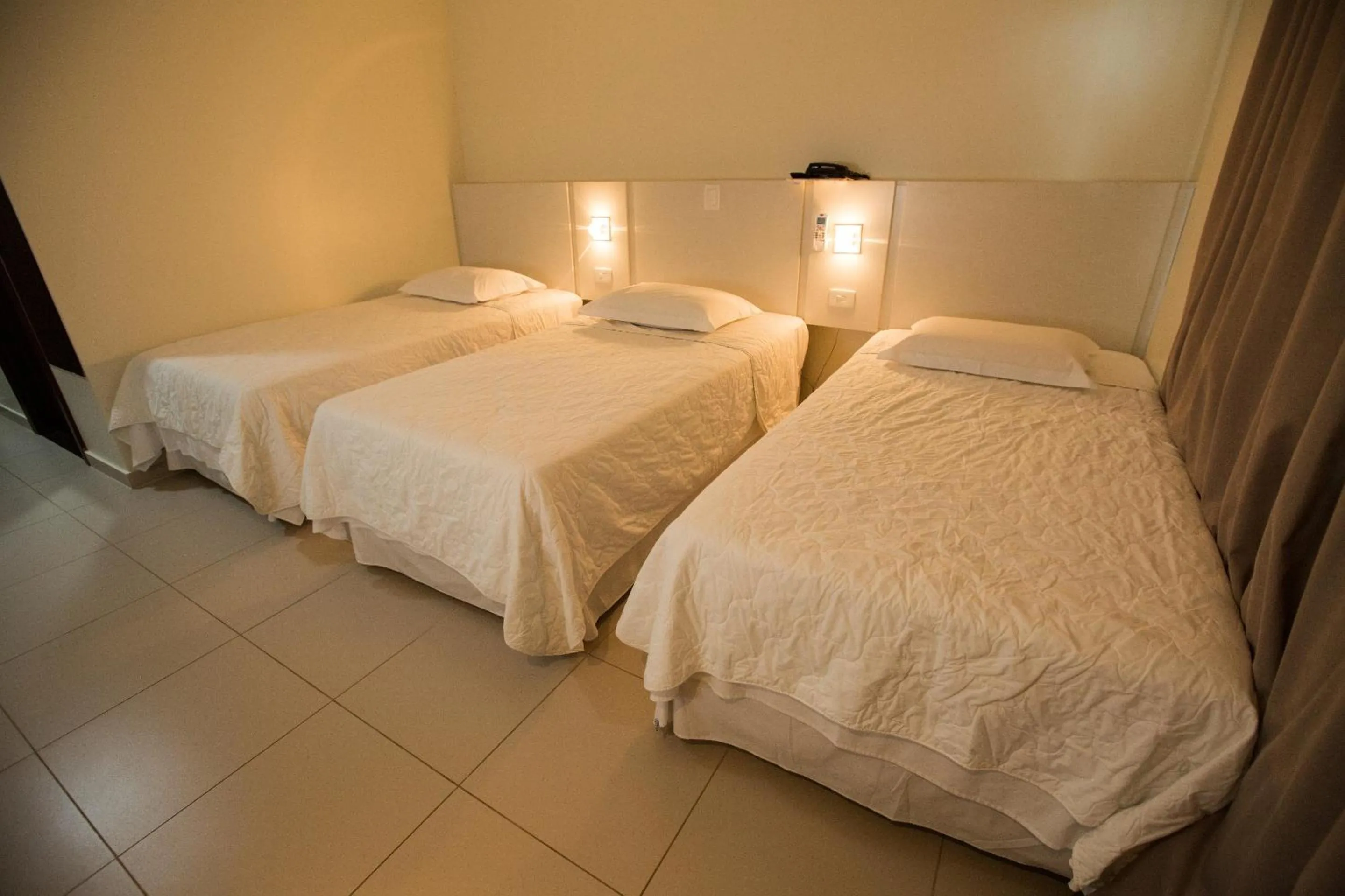 Bed in Golden Plaza Hotel