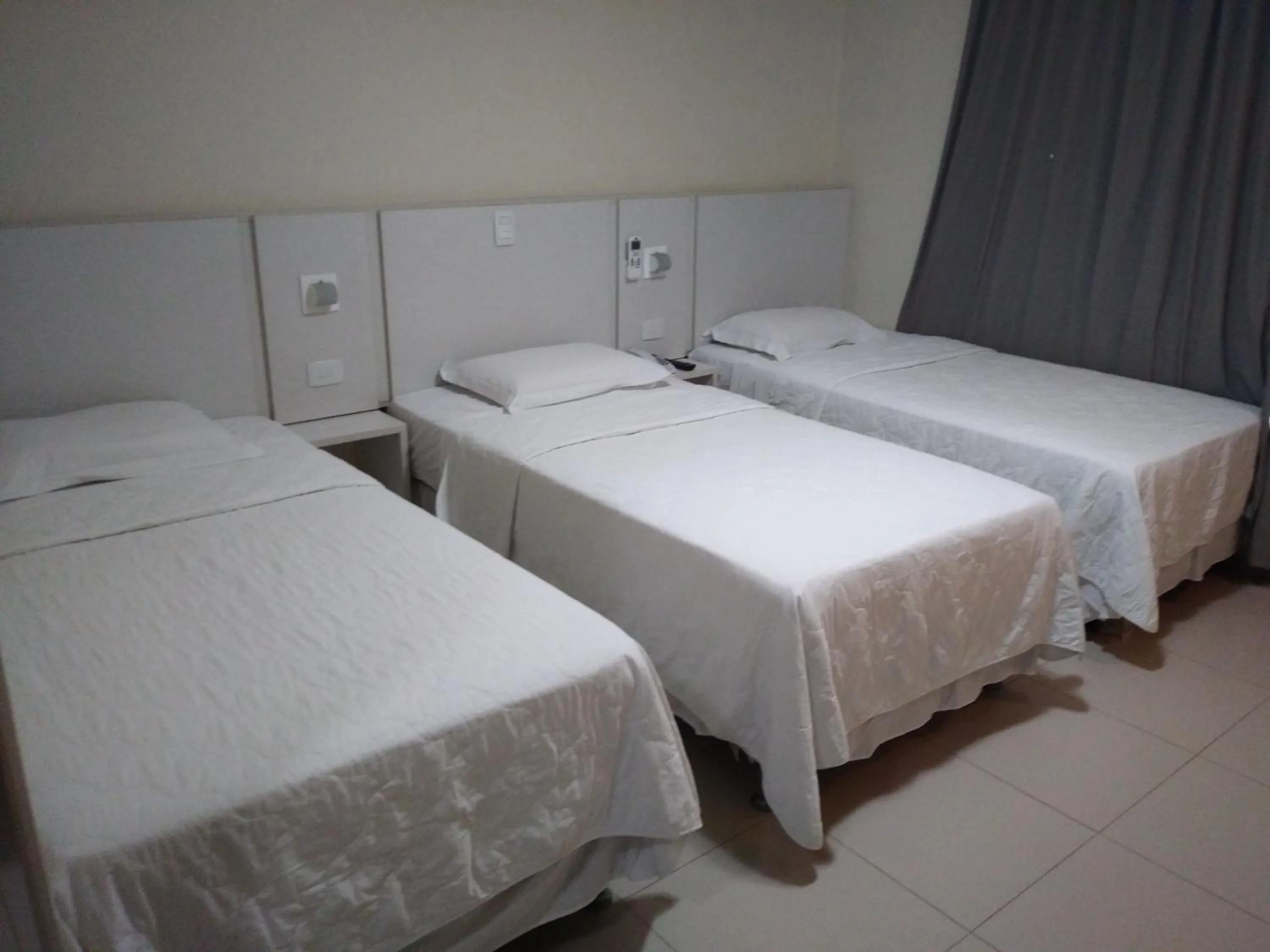 Bed in Golden Plaza Hotel