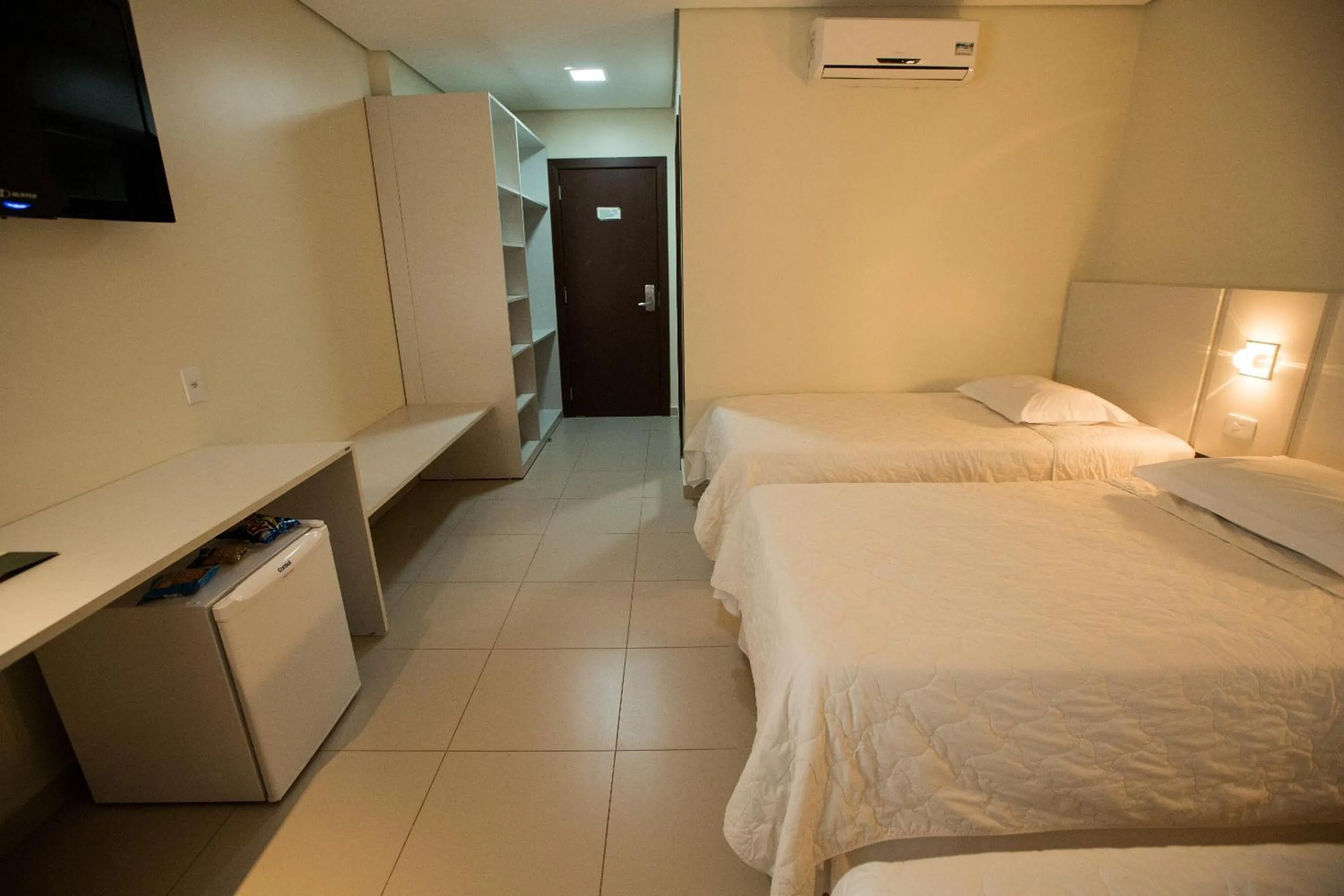 Bed in Golden Plaza Hotel