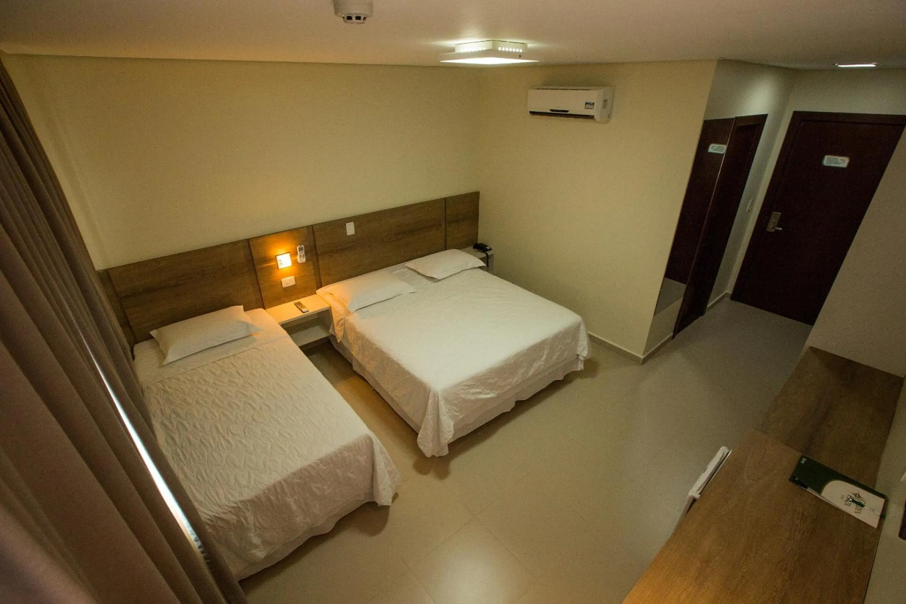 Bed in Golden Plaza Hotel