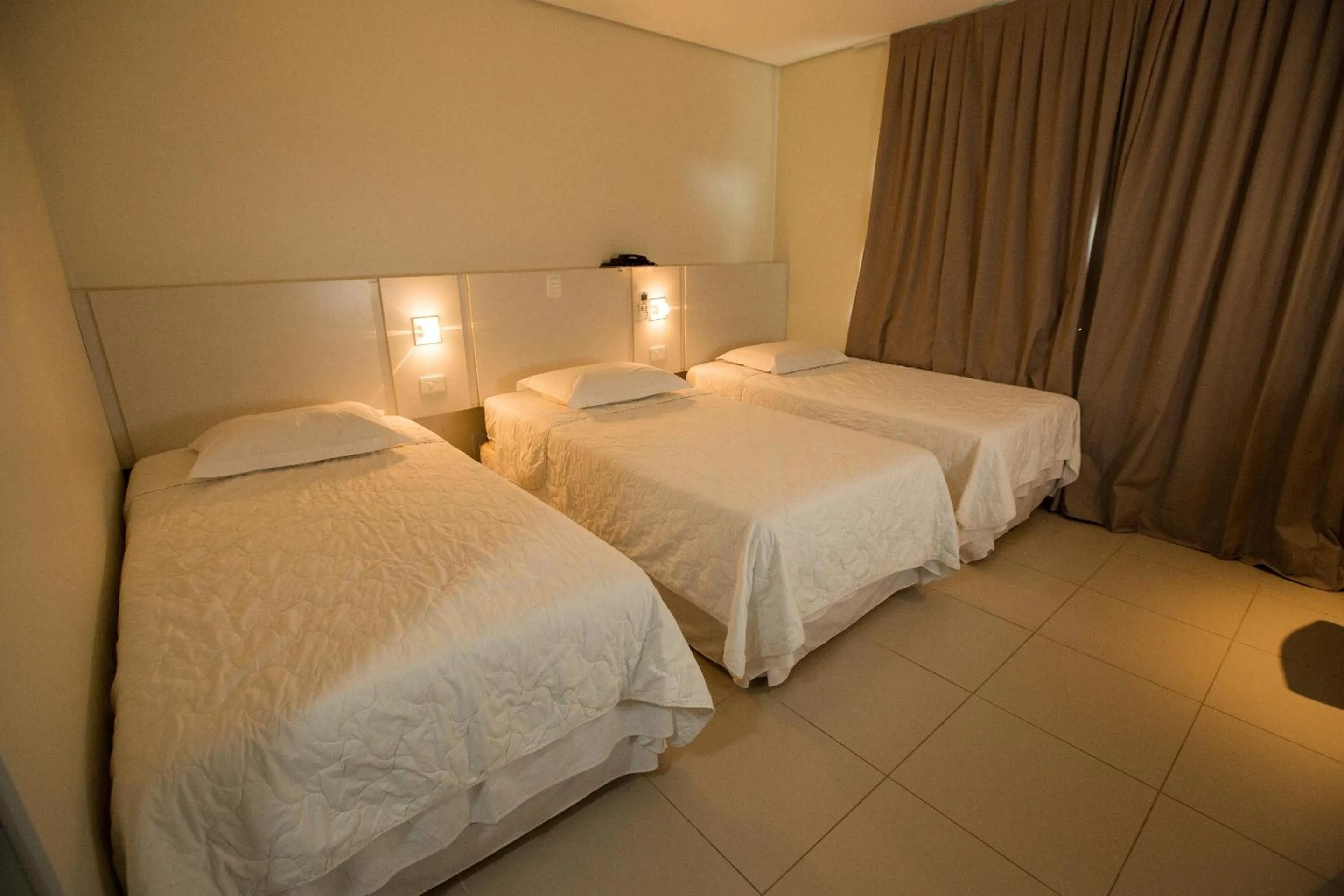 Bed in Golden Plaza Hotel