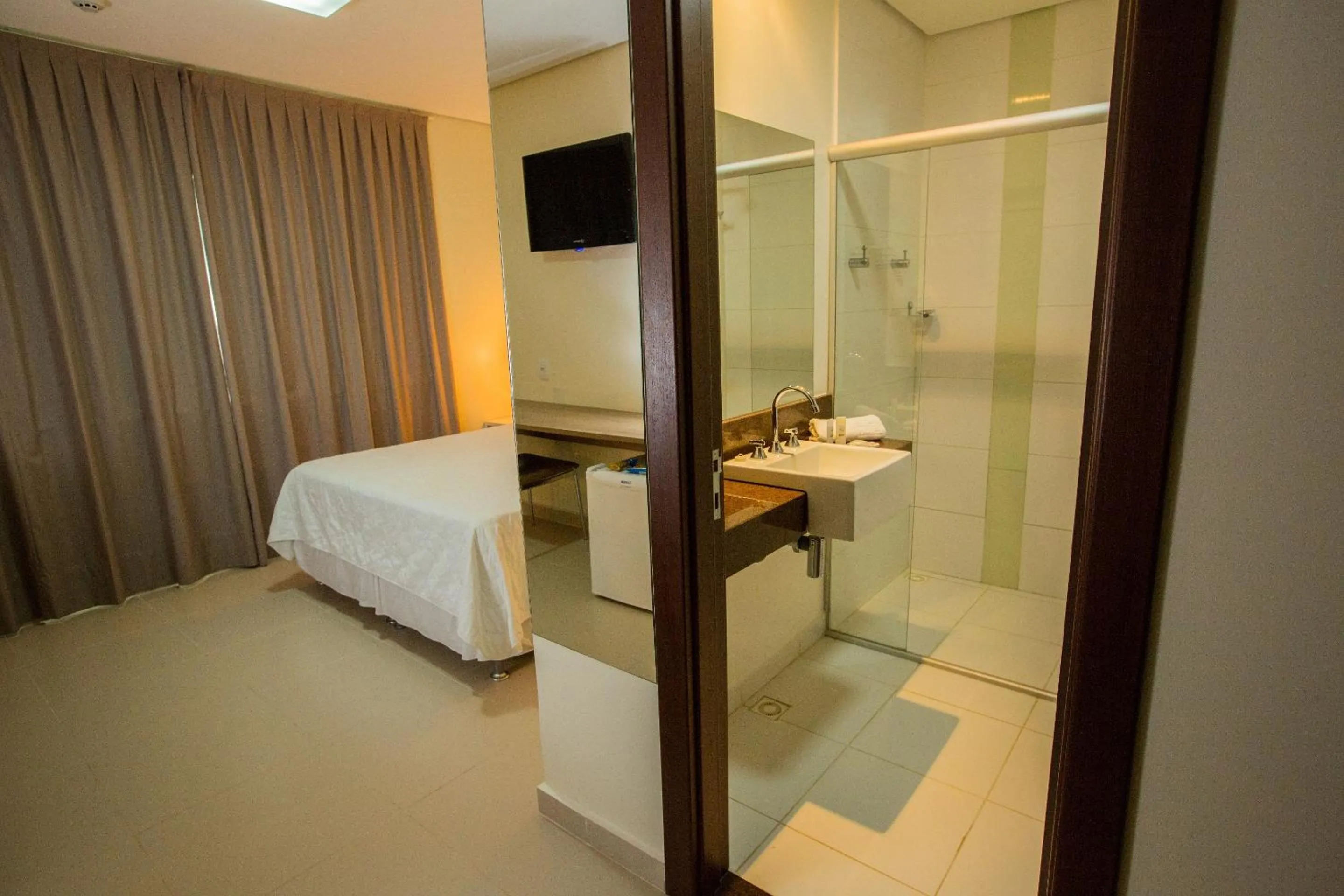Toilet, Bed in Golden Plaza Hotel