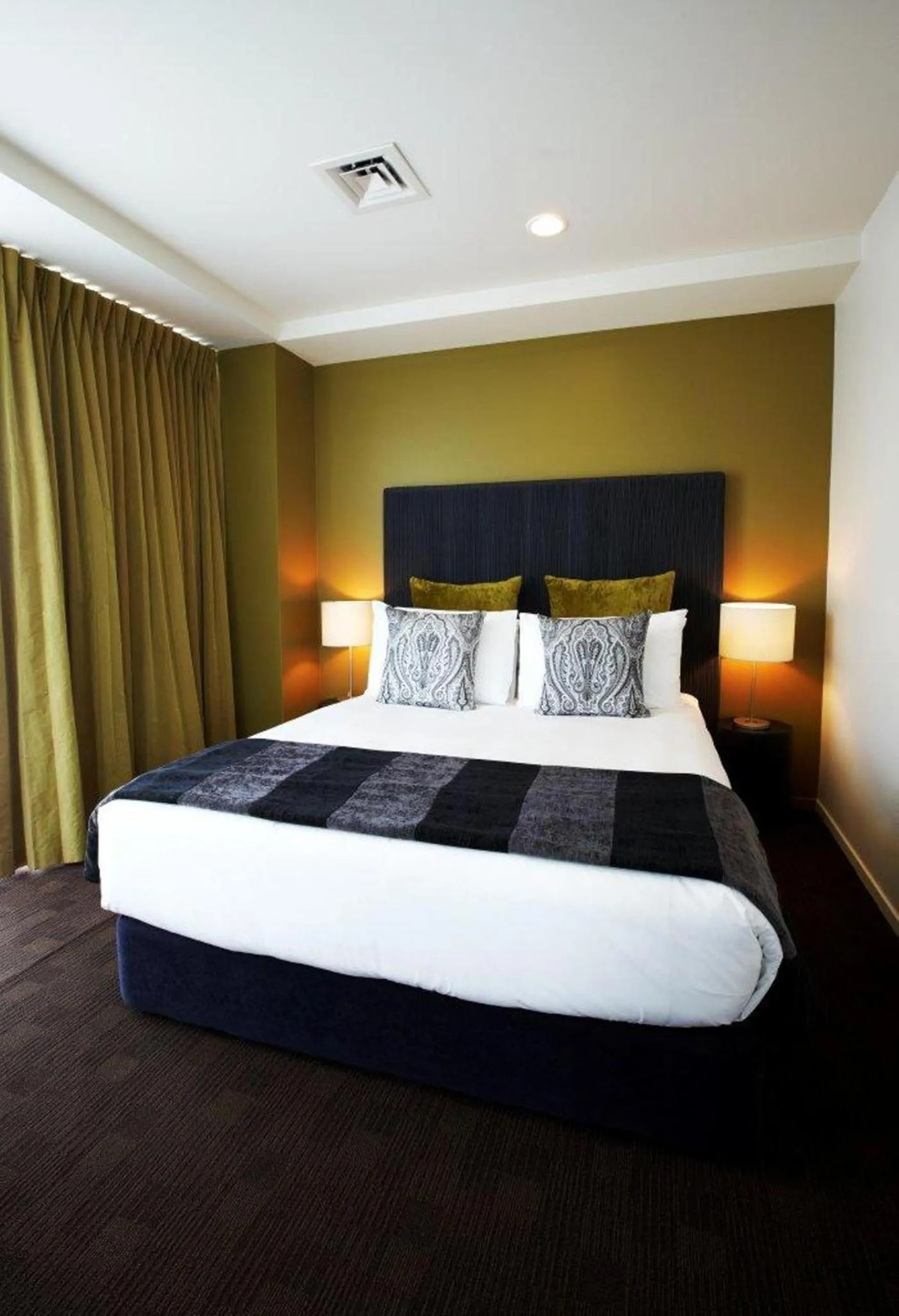 Bed in The Quadrant Hotel & Suites