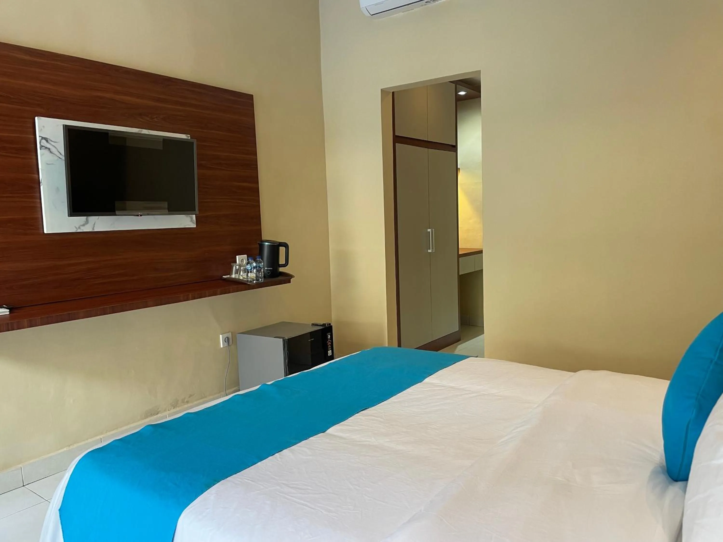 Bed in Seminyak Point Guest House