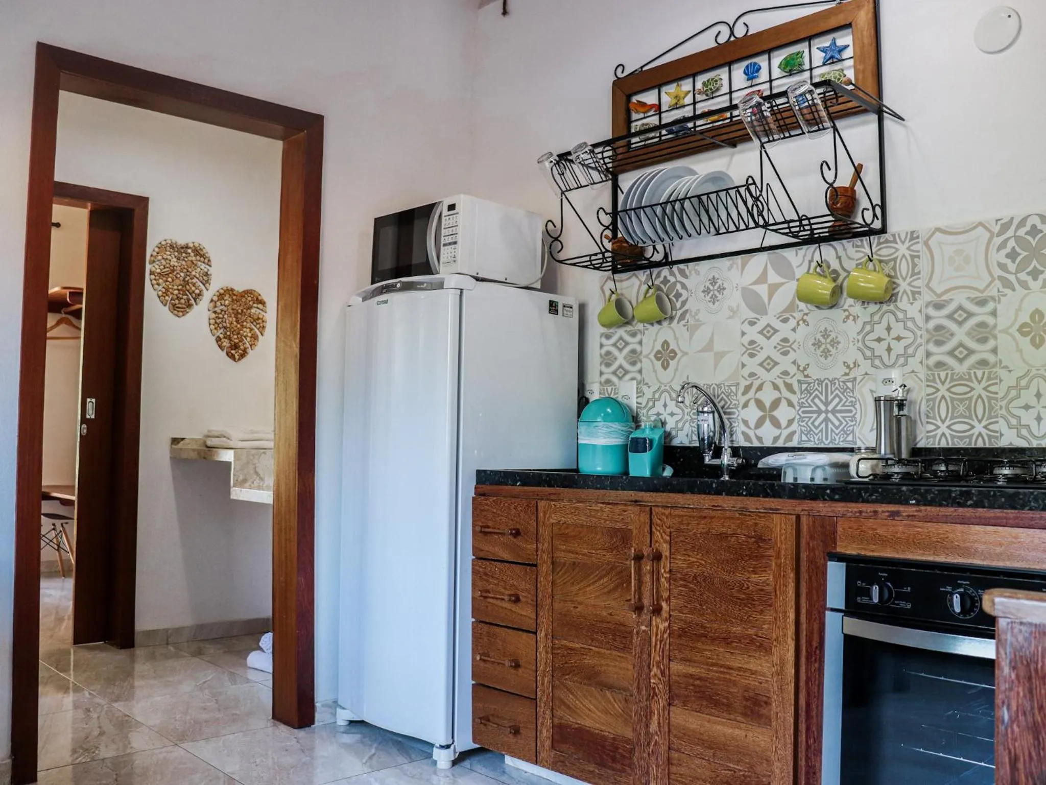 Kitchen or kitchenette in Conchas do Mar Residence
