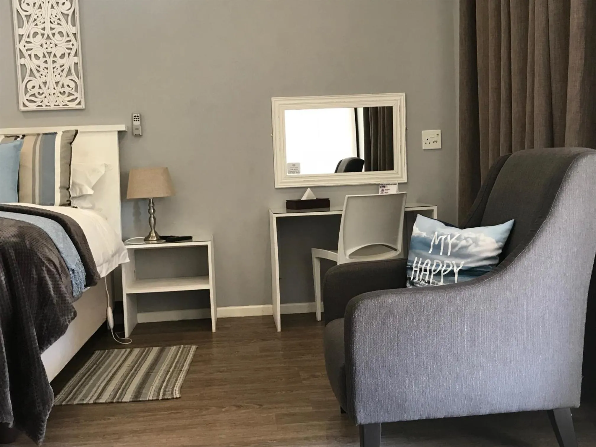 Seating area, Bed in Anathi Hotel