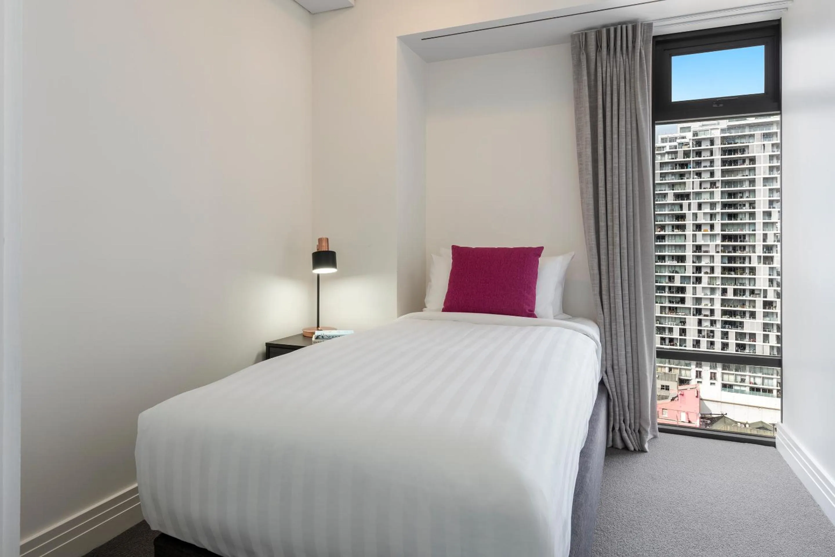 Bed in Avani Metropolis Auckland Residences