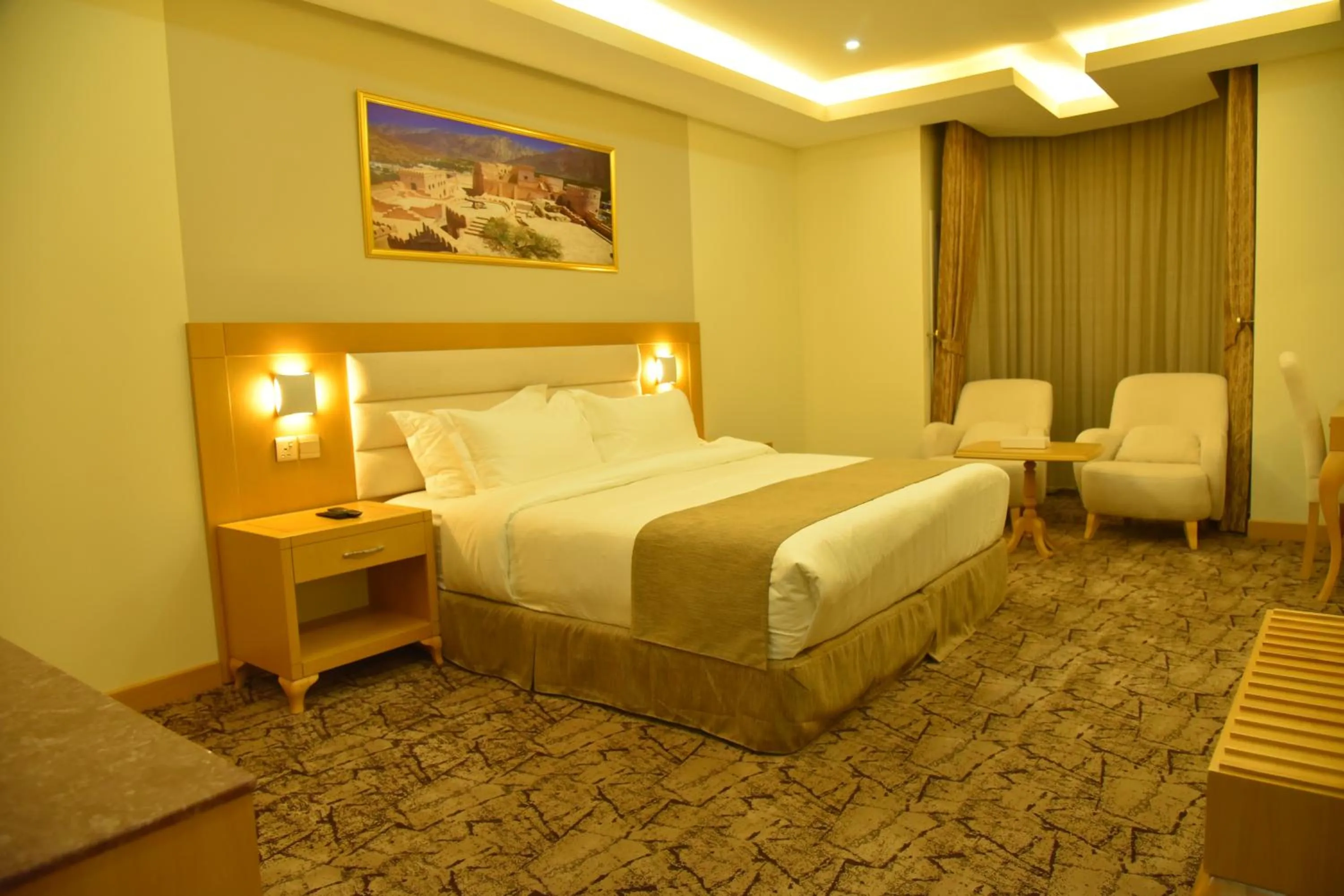 Bed in Muscat Plaza Hotel