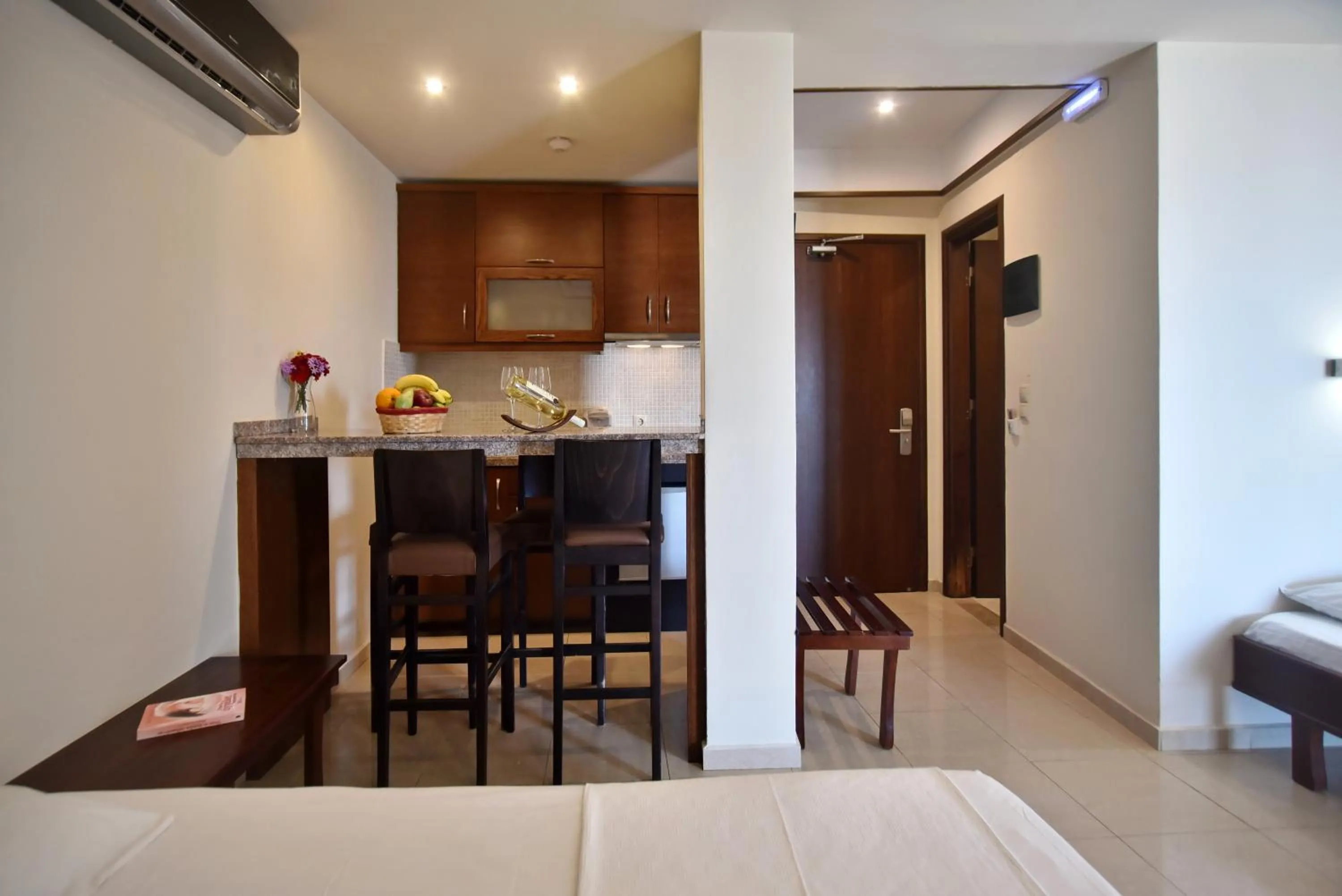 Kitchen or kitchenette, Bed in 24 Seven Boutique Hotel