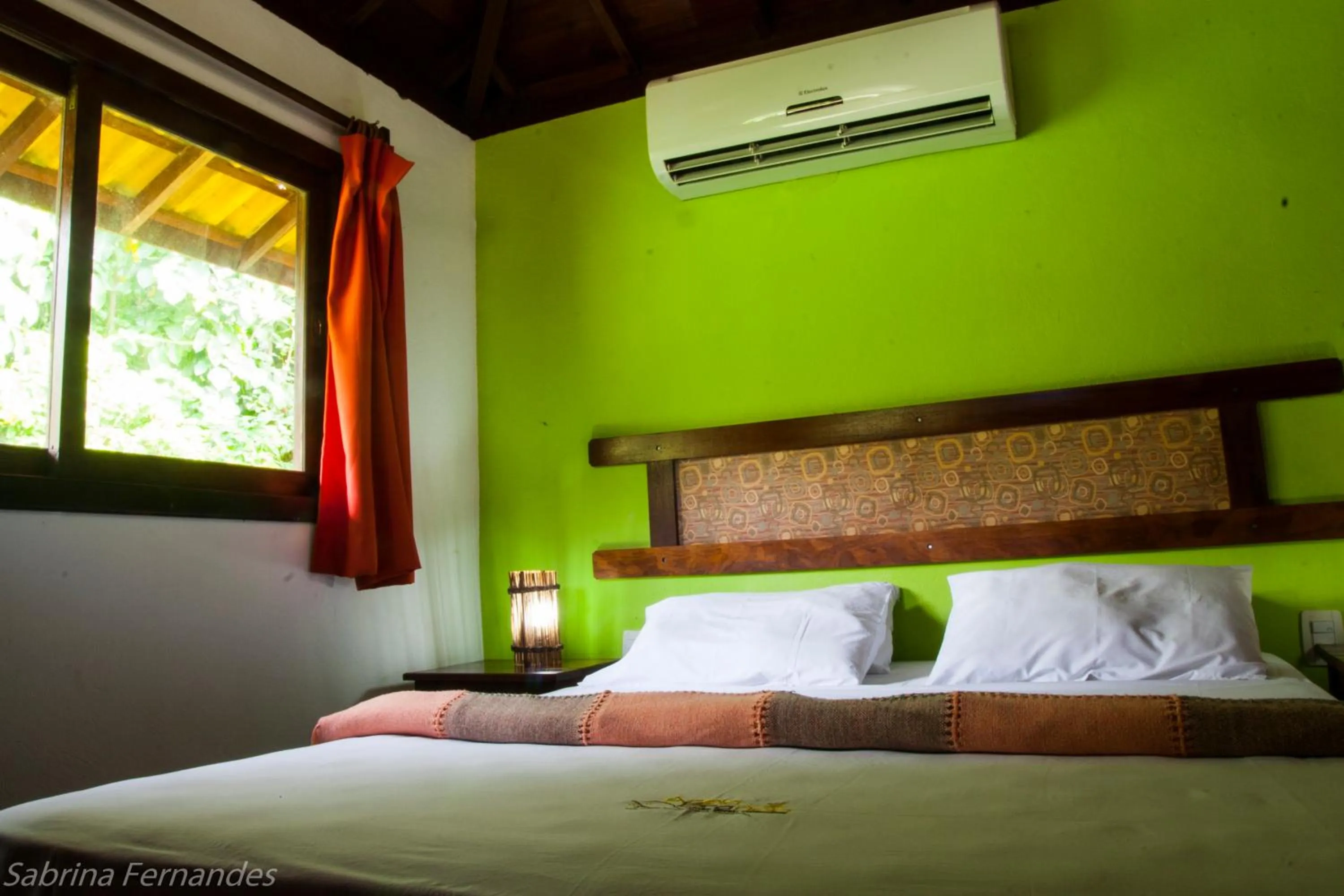 Text overlay, Bed in Areia Branca Apart Hotel