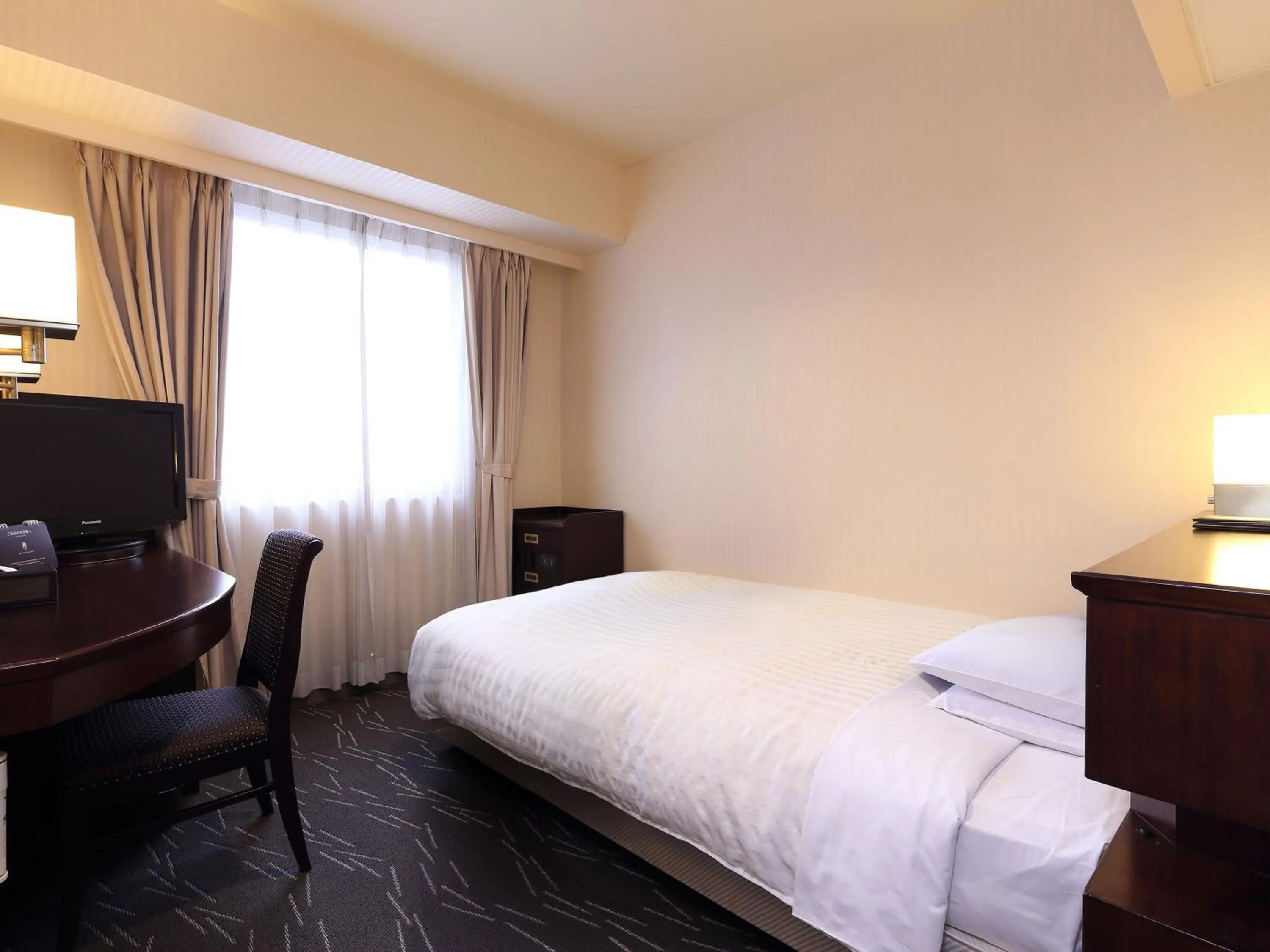 Bedroom, Bed in Nishitetsu Grand Hotel