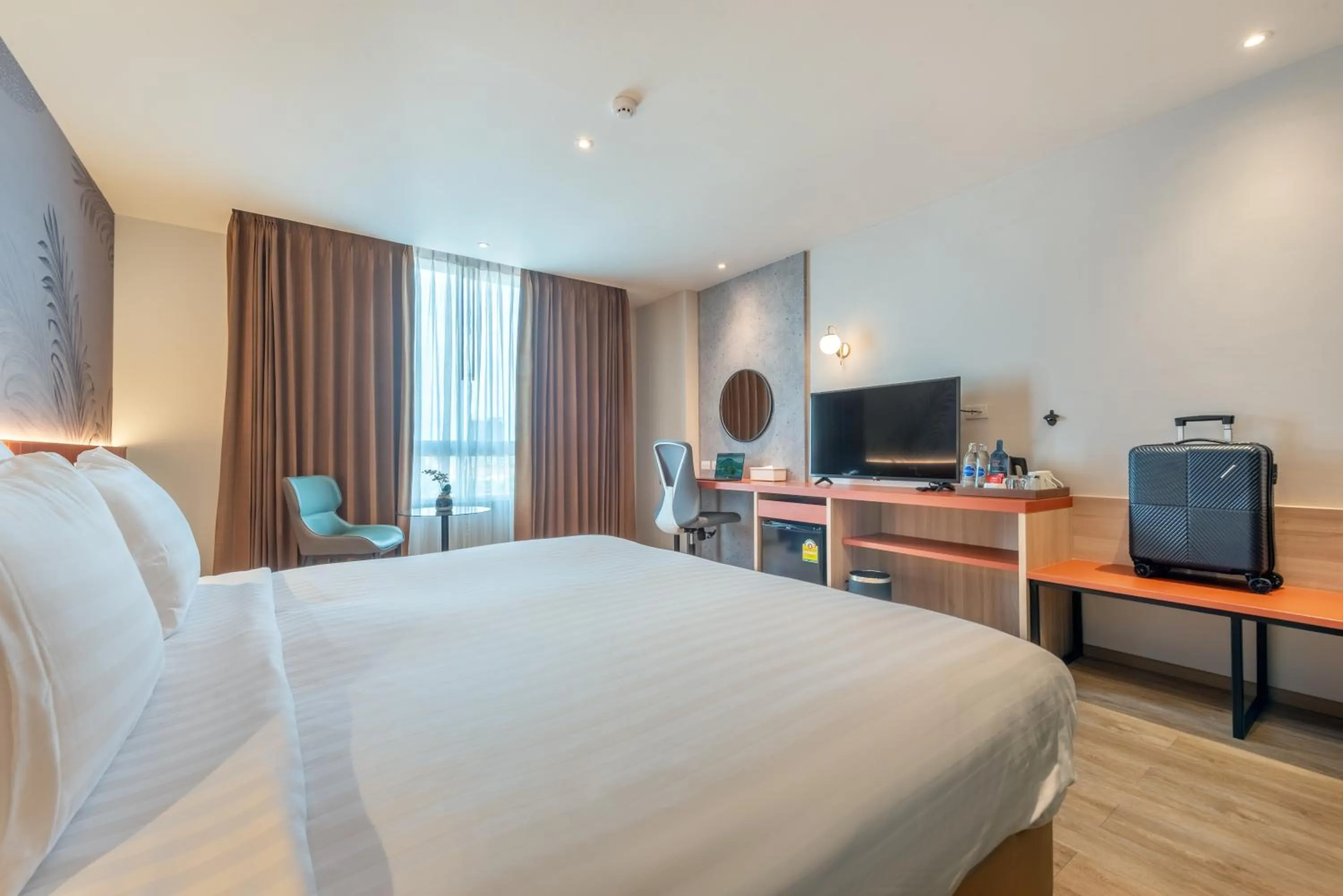 Bed in Buri Sriphu Hotel