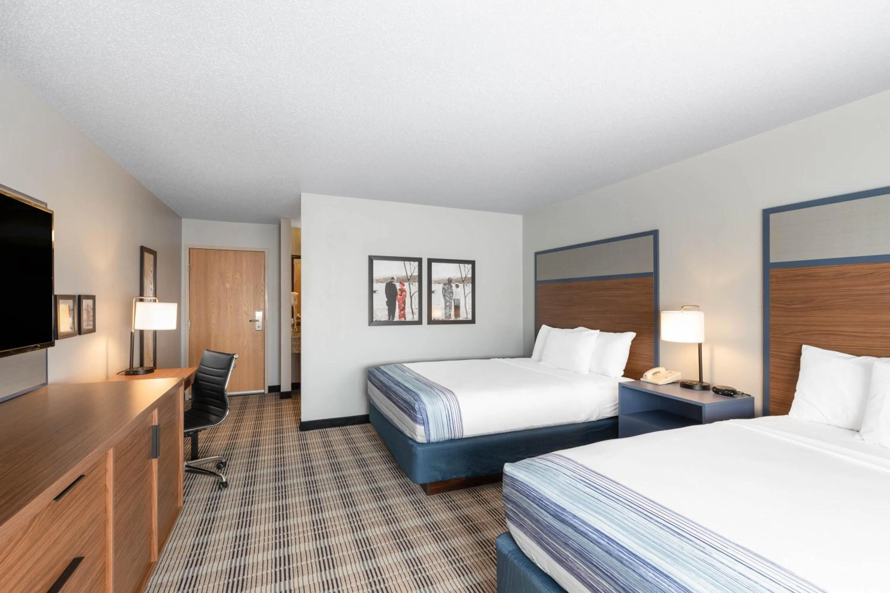 Bed in AmericInn by Wyndham Jackson