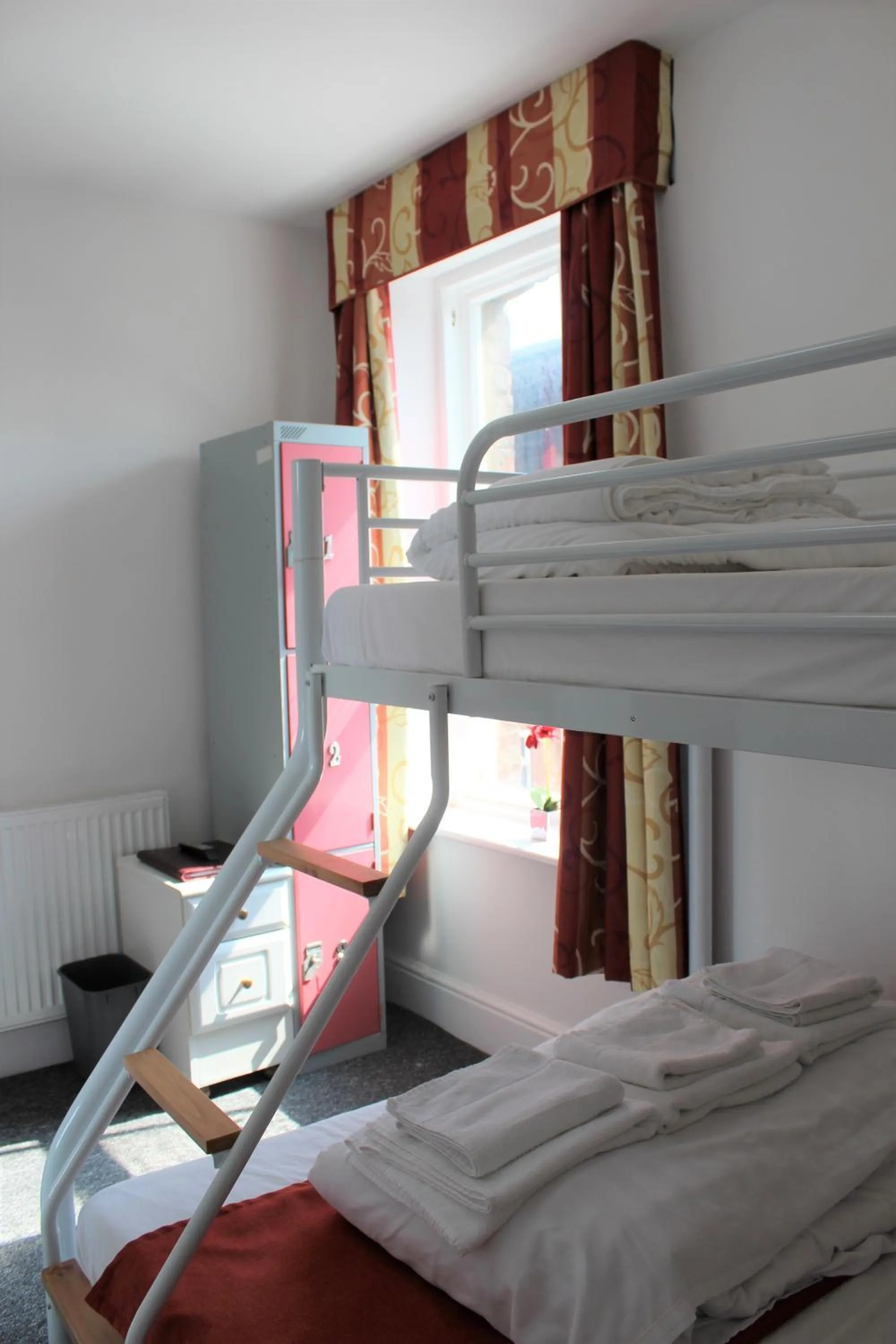 Photo of the whole room, Bed in Backpackers Blackpool Hotel & Suites