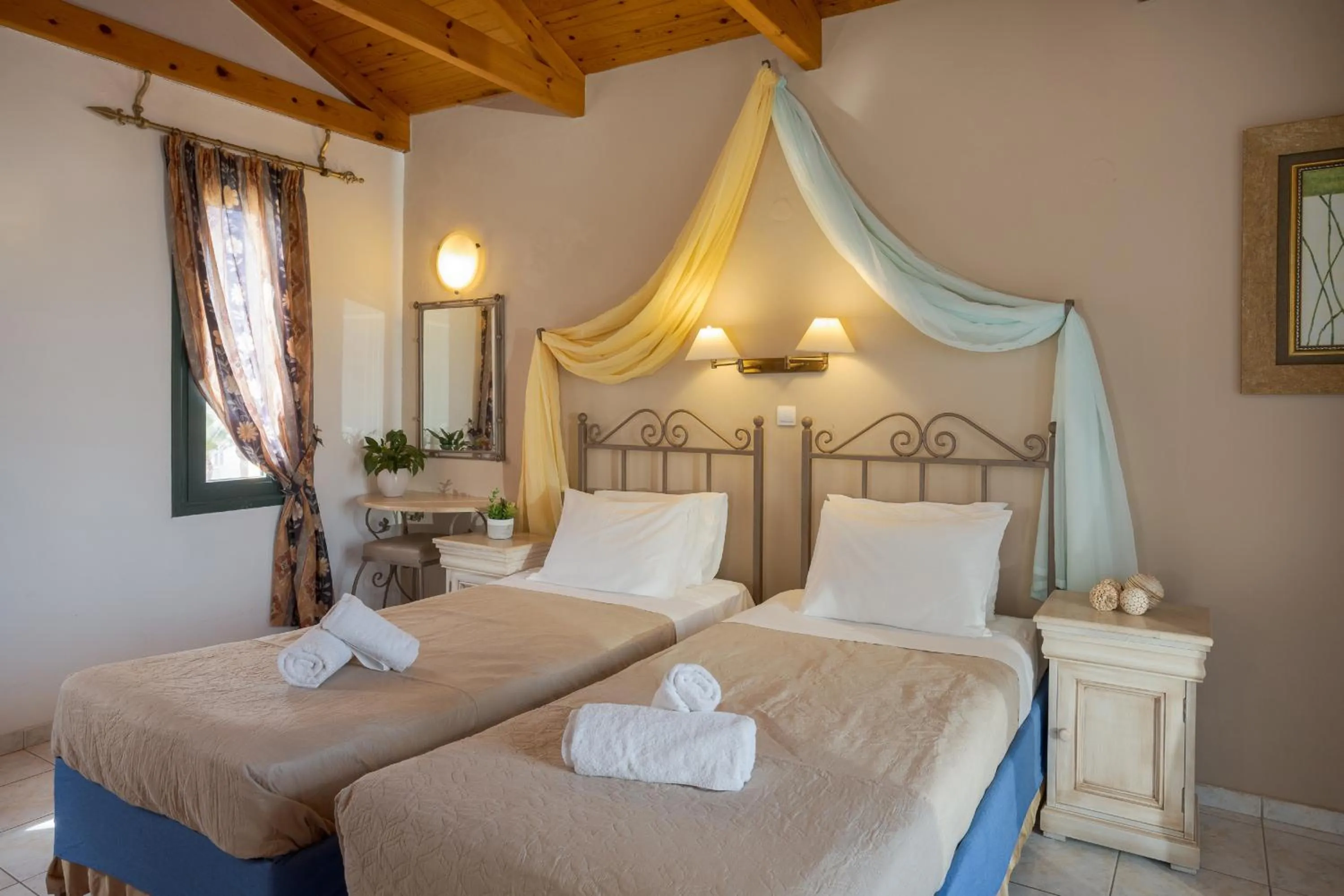 Bed in Irida Aparthotel Malia by Estia