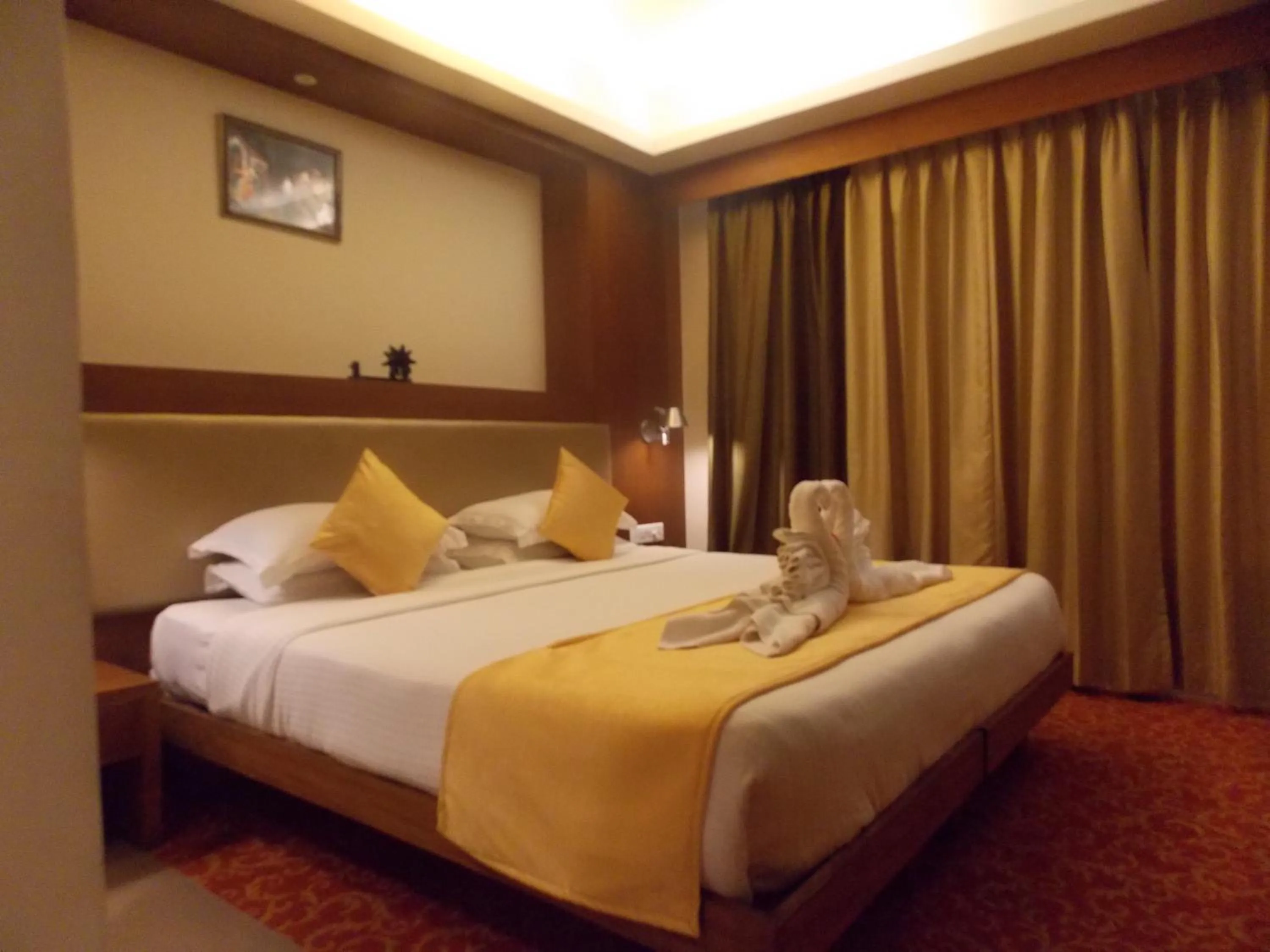 Bed in SilverCloud Hotel and Banquets