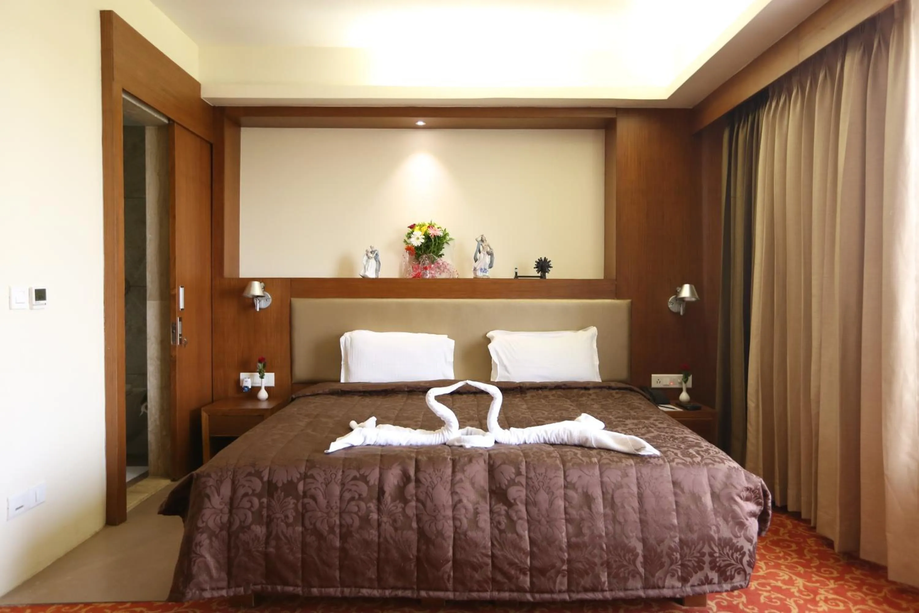 Bed in SilverCloud Hotel and Banquets