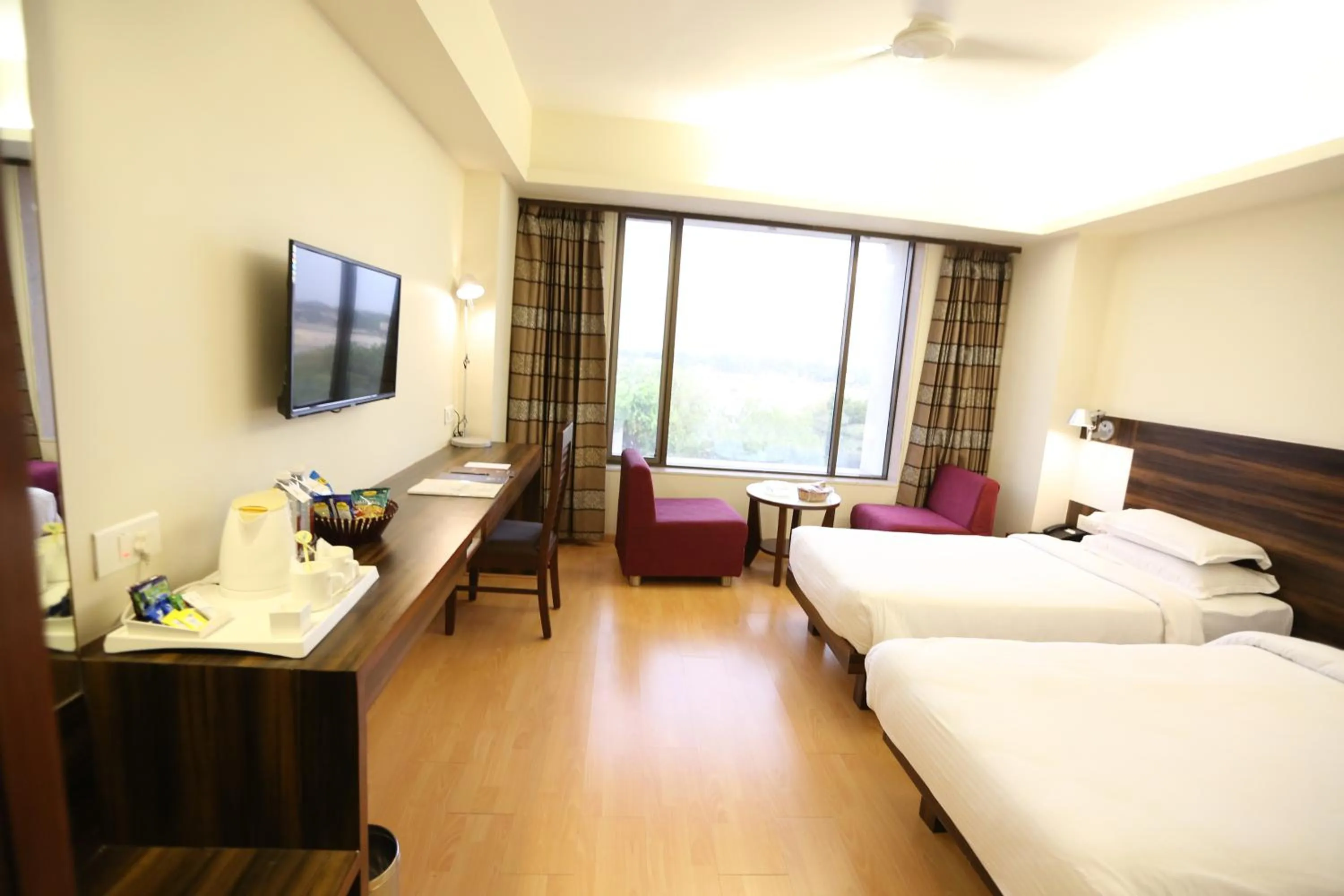 Photo of the whole room, Bed in SilverCloud Hotel and Banquets