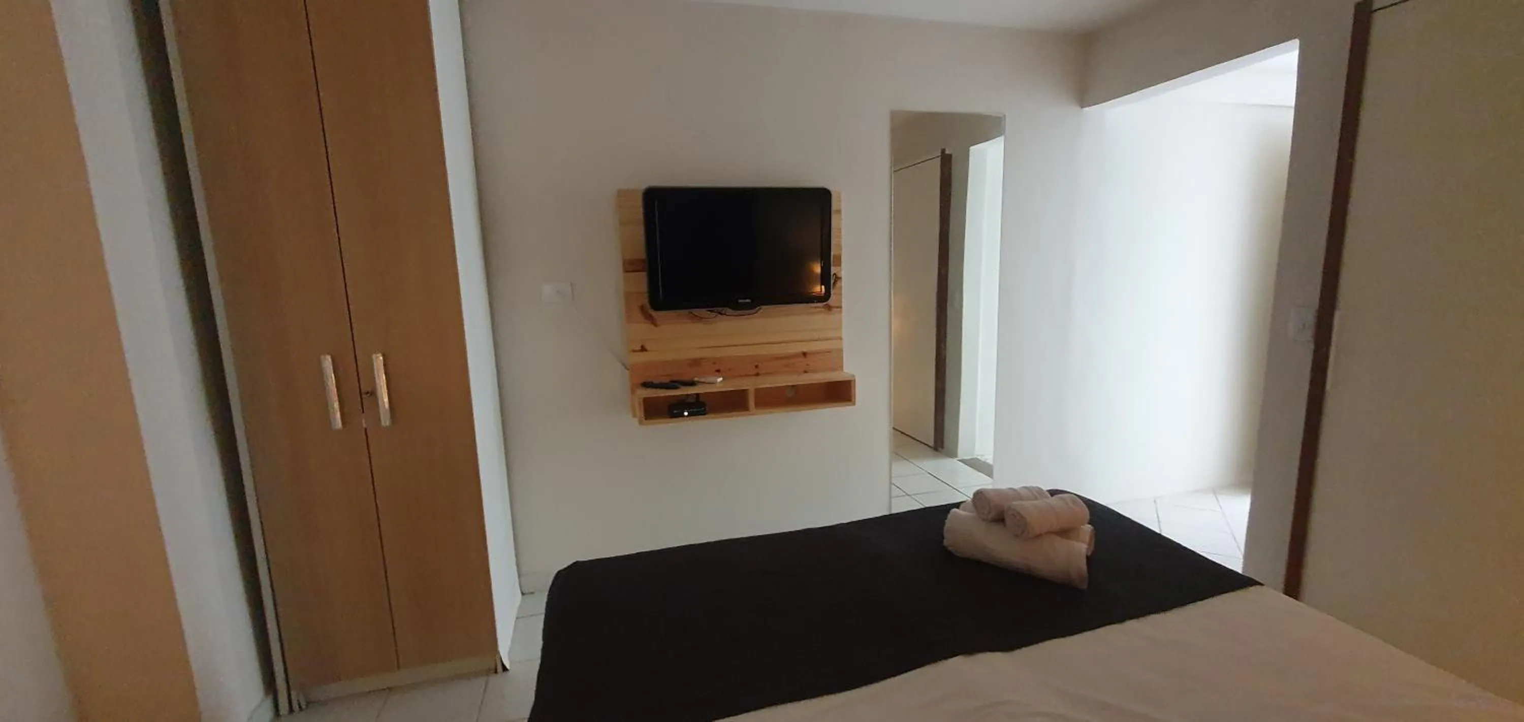 Communal lounge/ TV room, Bed in Pousada Aratu